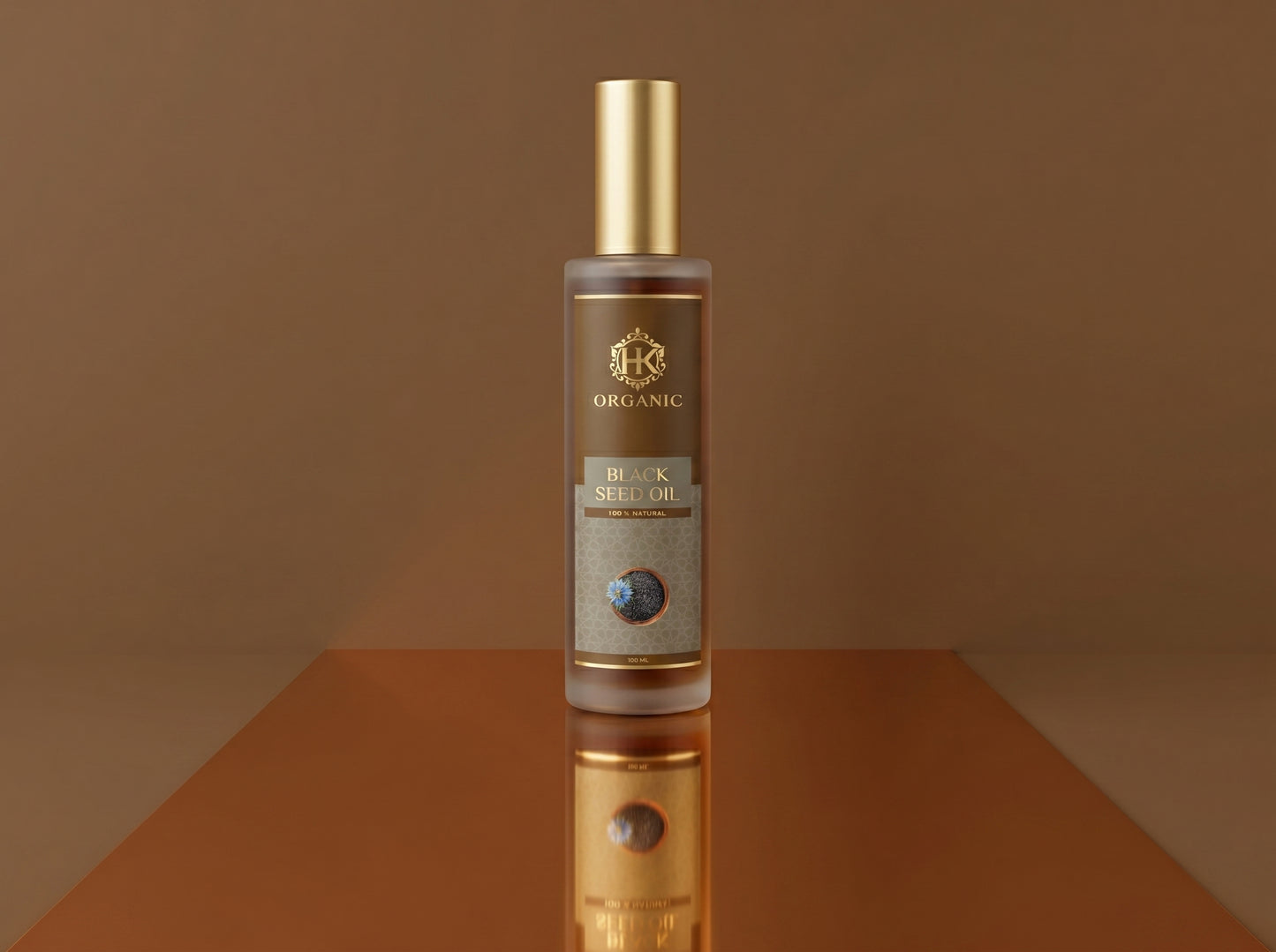 Bottle of organic black scullion oil on a reflective surface with a brown background