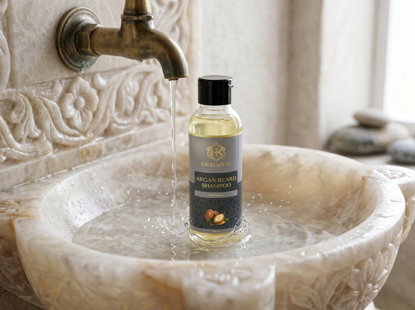 Bottle of Orlane Argan Beard Shampoo in a marble sink with water flowing.