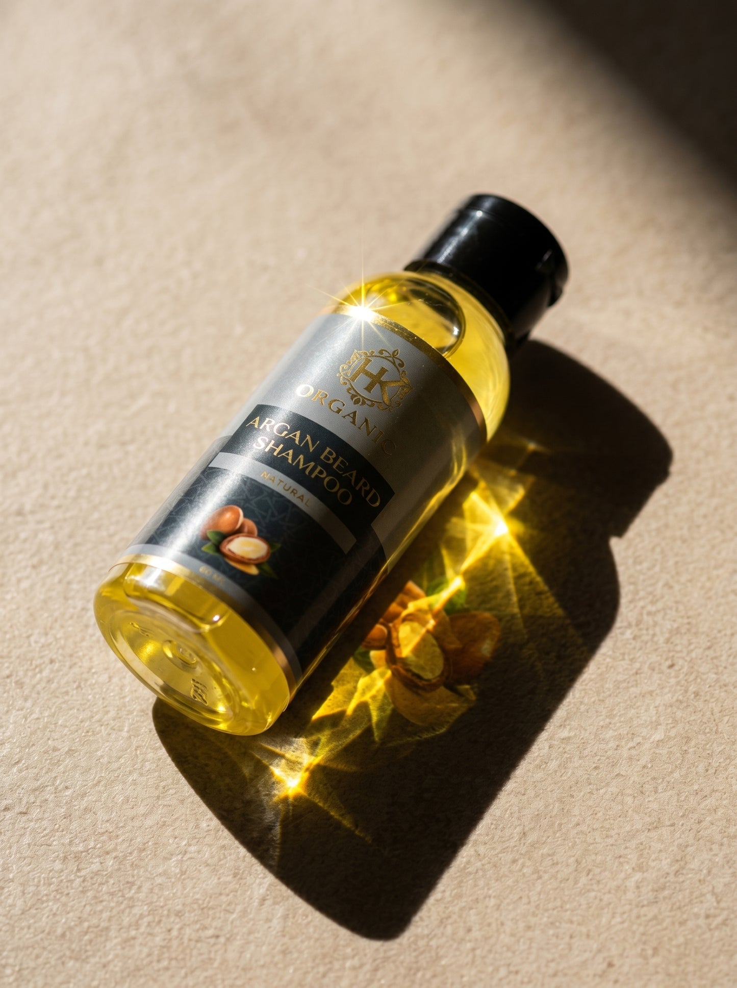 Bottle of Argan Island Shampoo on a beige surface with warm lighting