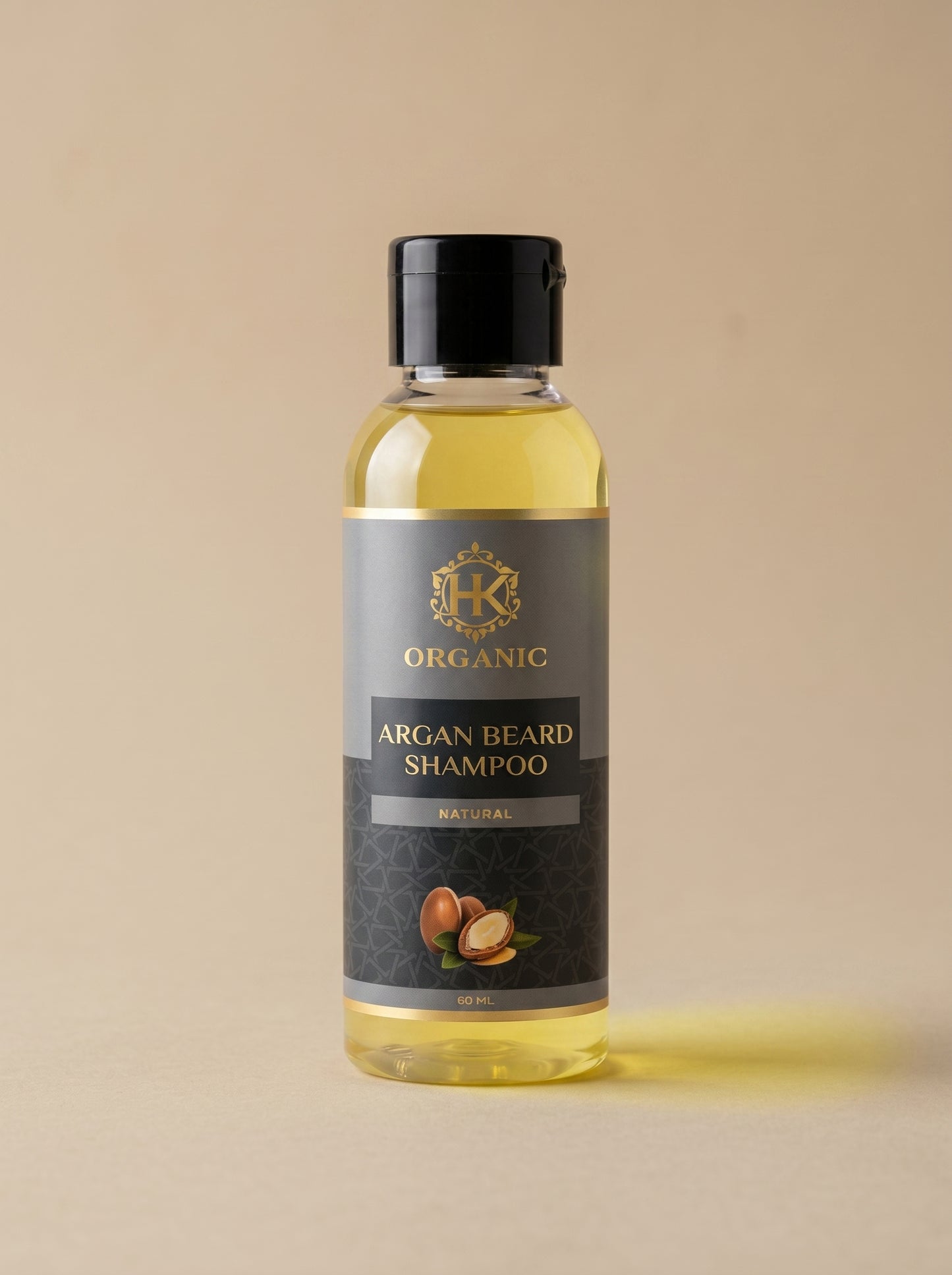 Bottle of argan beard shampoo with a beige background