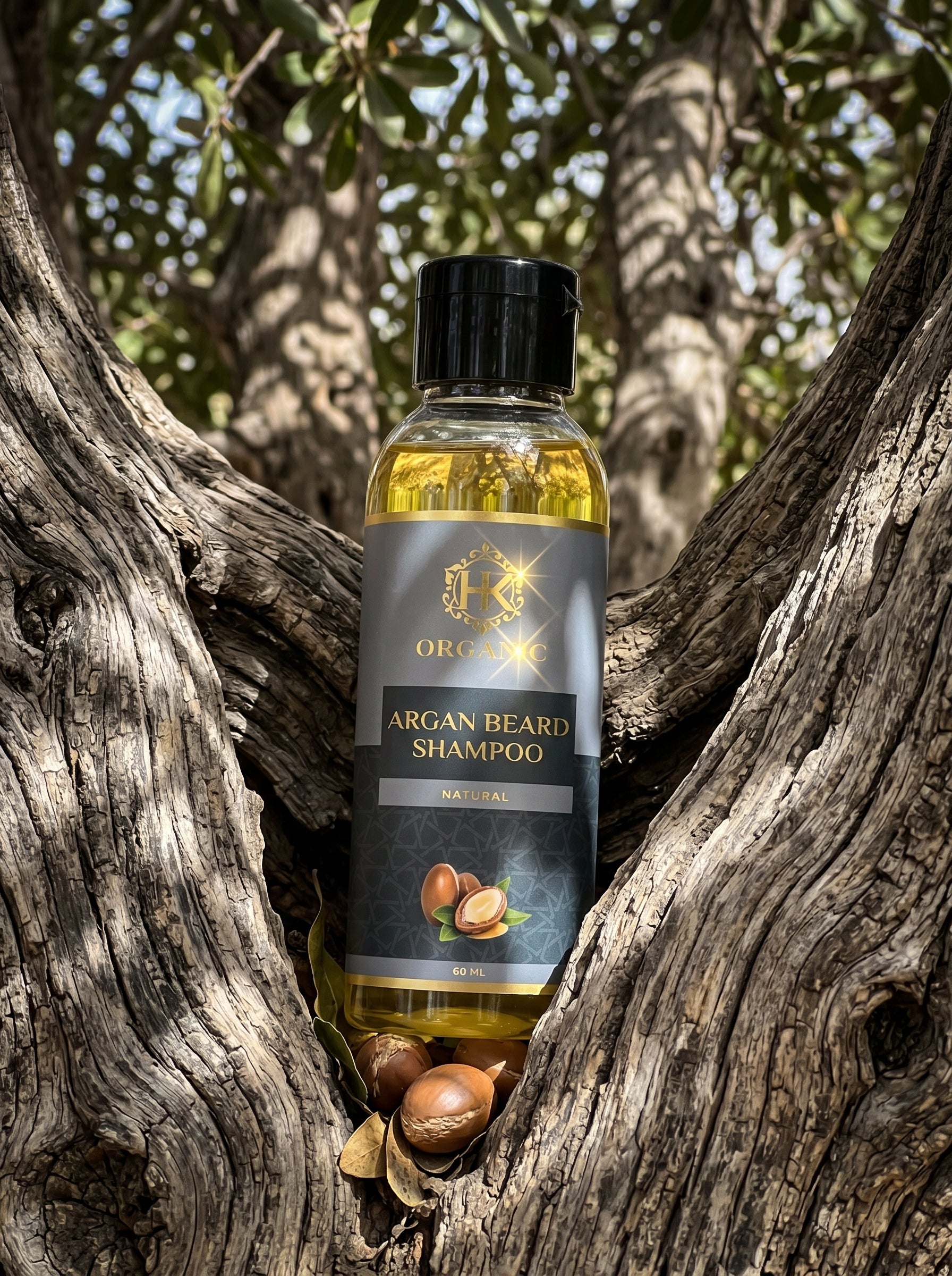 Bottle of Argan Beard Shampoo surrounded by argan nuts in a natural setting