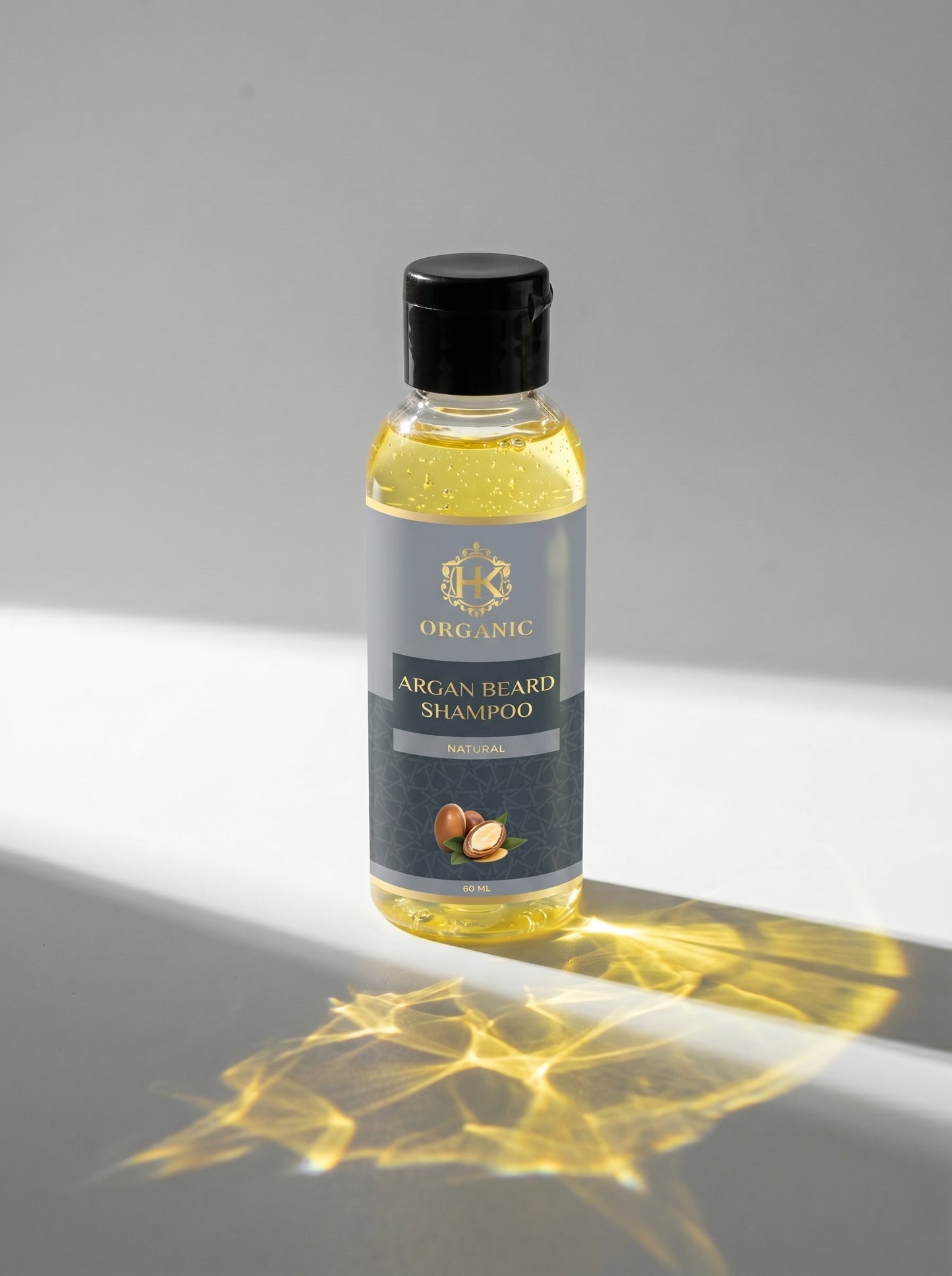 Bottle of organic argan beard shampoo on a gray background