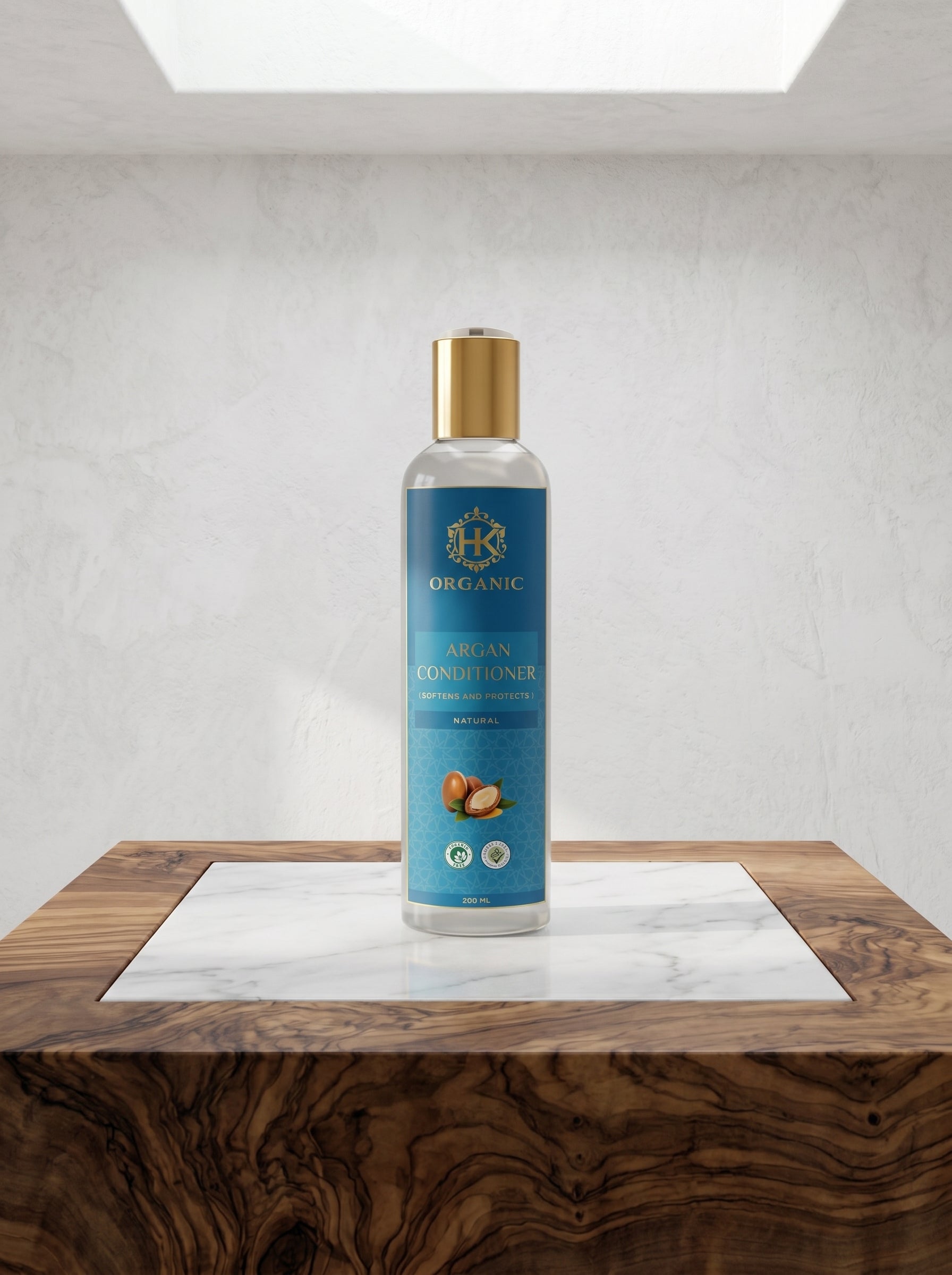 Bottle of organic argan conditioner on a wooden surface with a white background