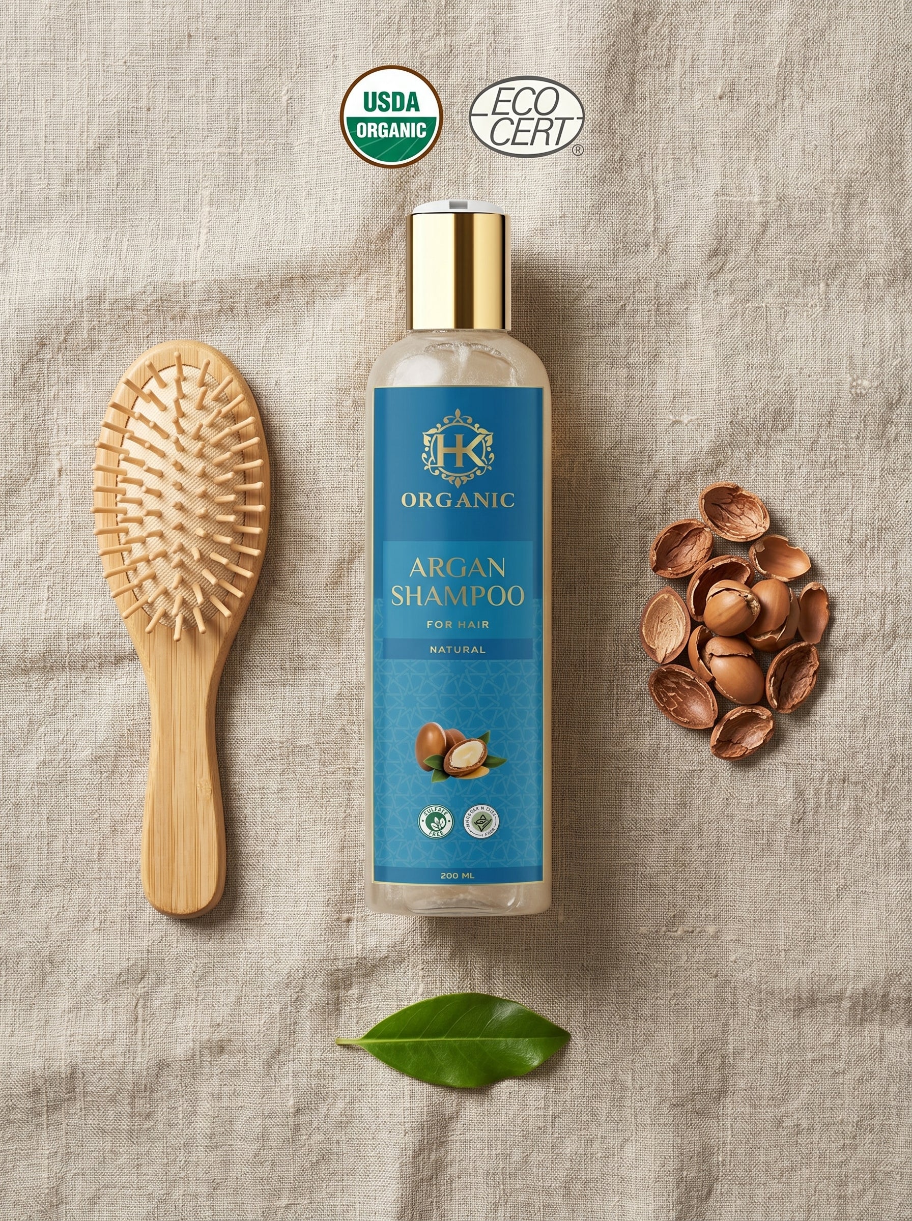 Organic argan shampoo bottle with a brush and nuts on a textured surface
