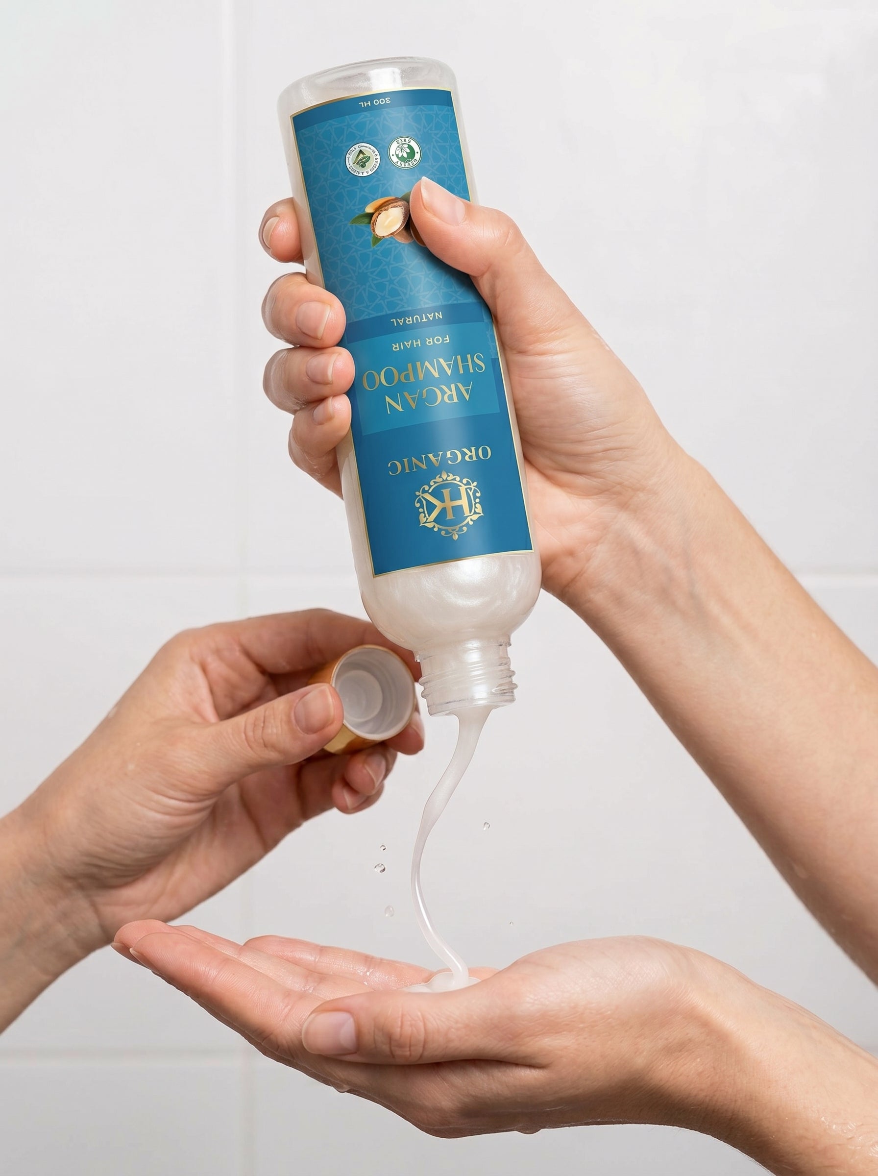 Person holding a bottle of Davines Nourish hair product with a white background