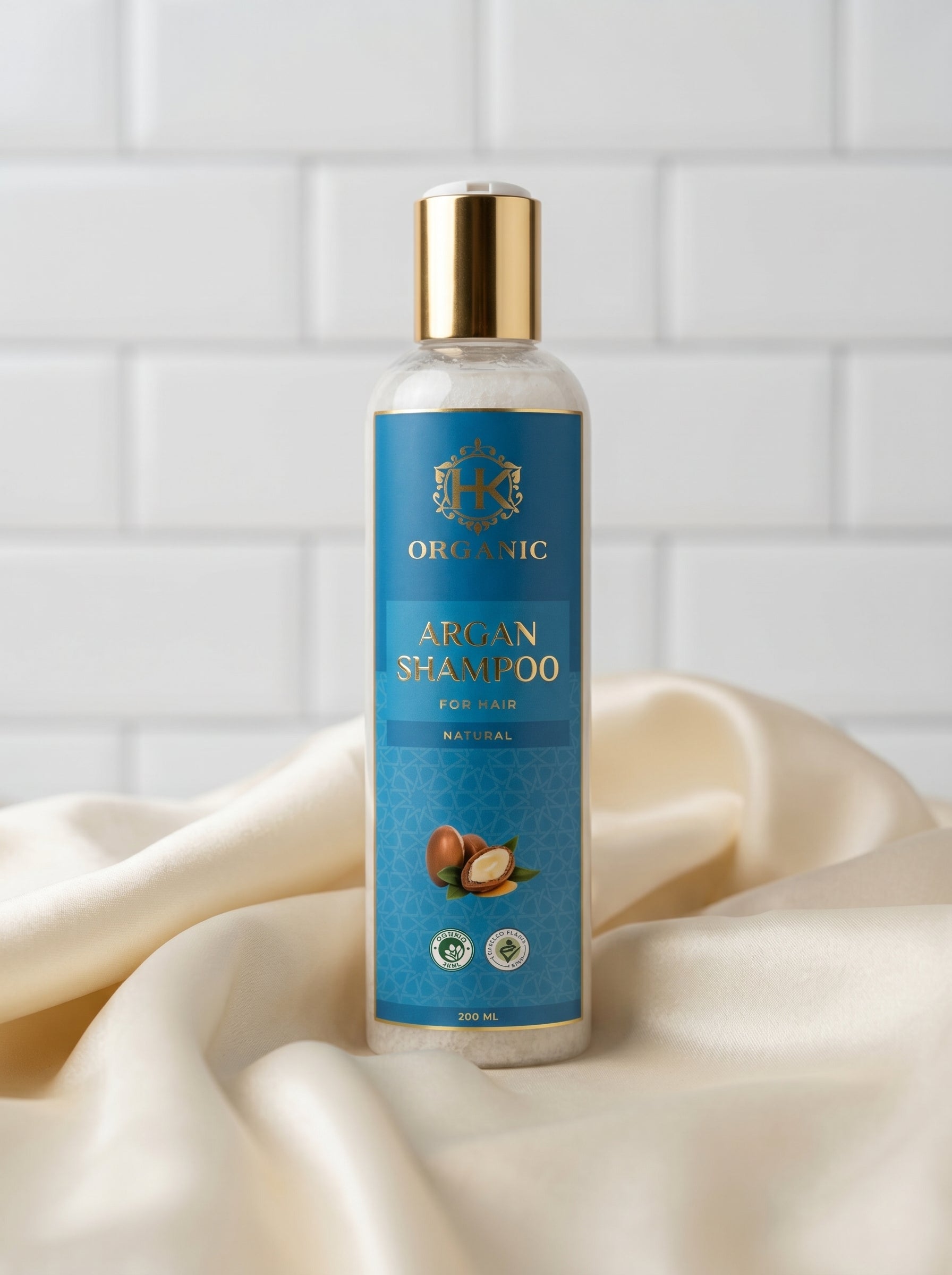 Bottle of Argan Shampoo on a white fabric background