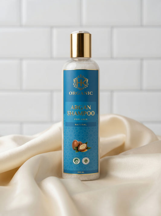 Bottle of Argan Shampoo on a white fabric background