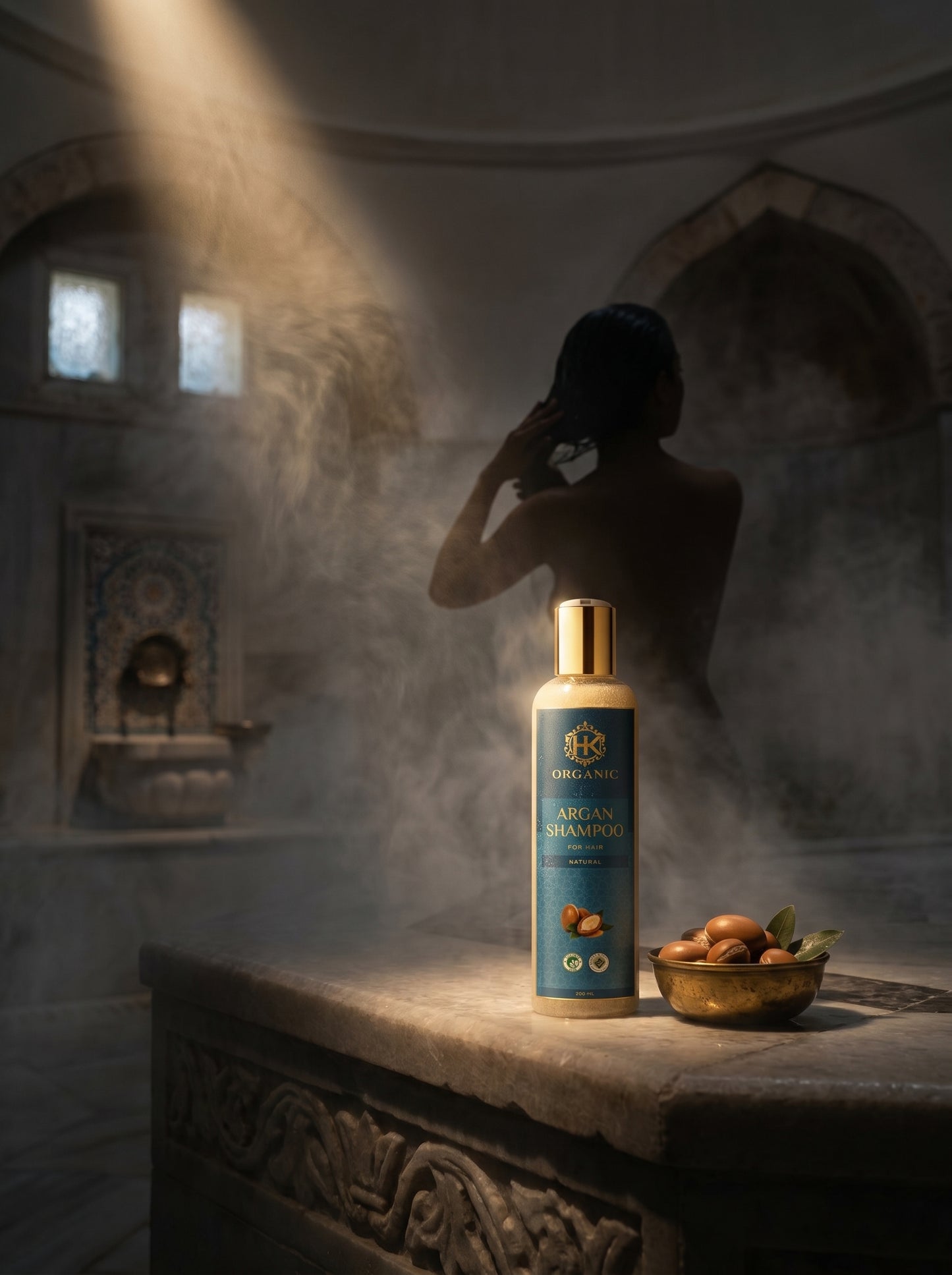 Shampoo bottle on a stone surface with a person in the background, bathed in soft light.