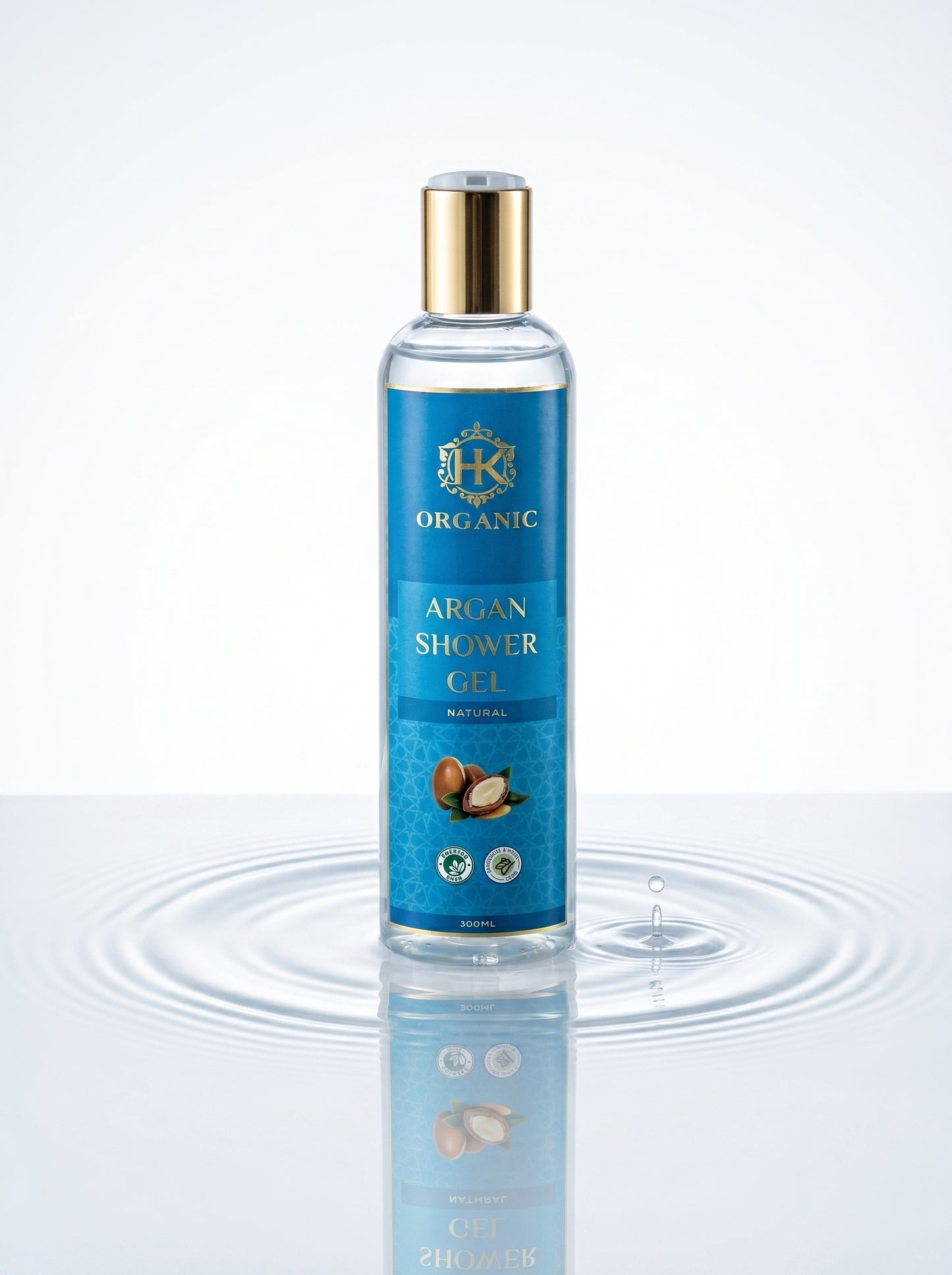 Bottle of organic argan shower gel with a blue label on a white background