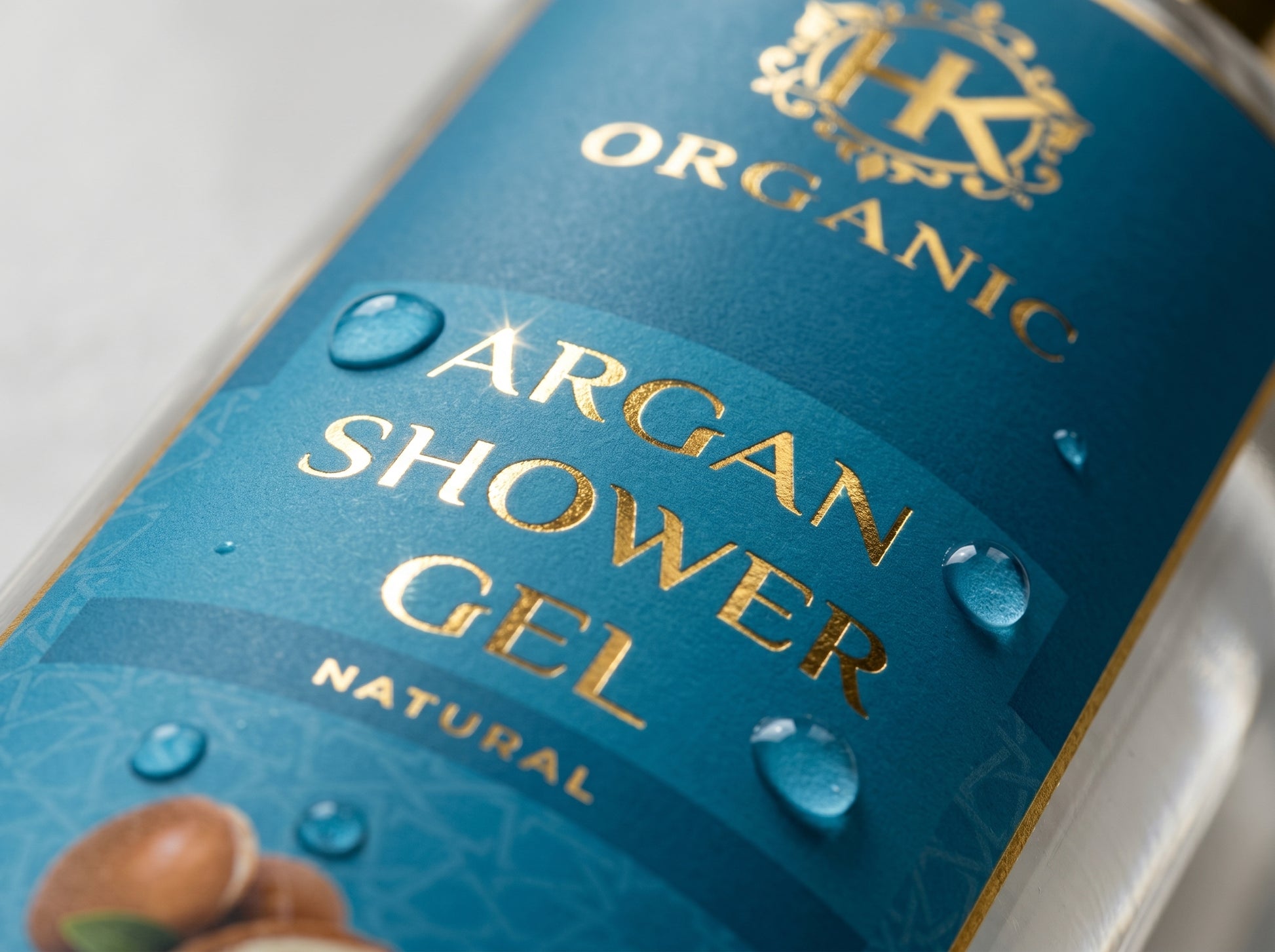 Organic argan shower gel packaging with blue label and gold text.