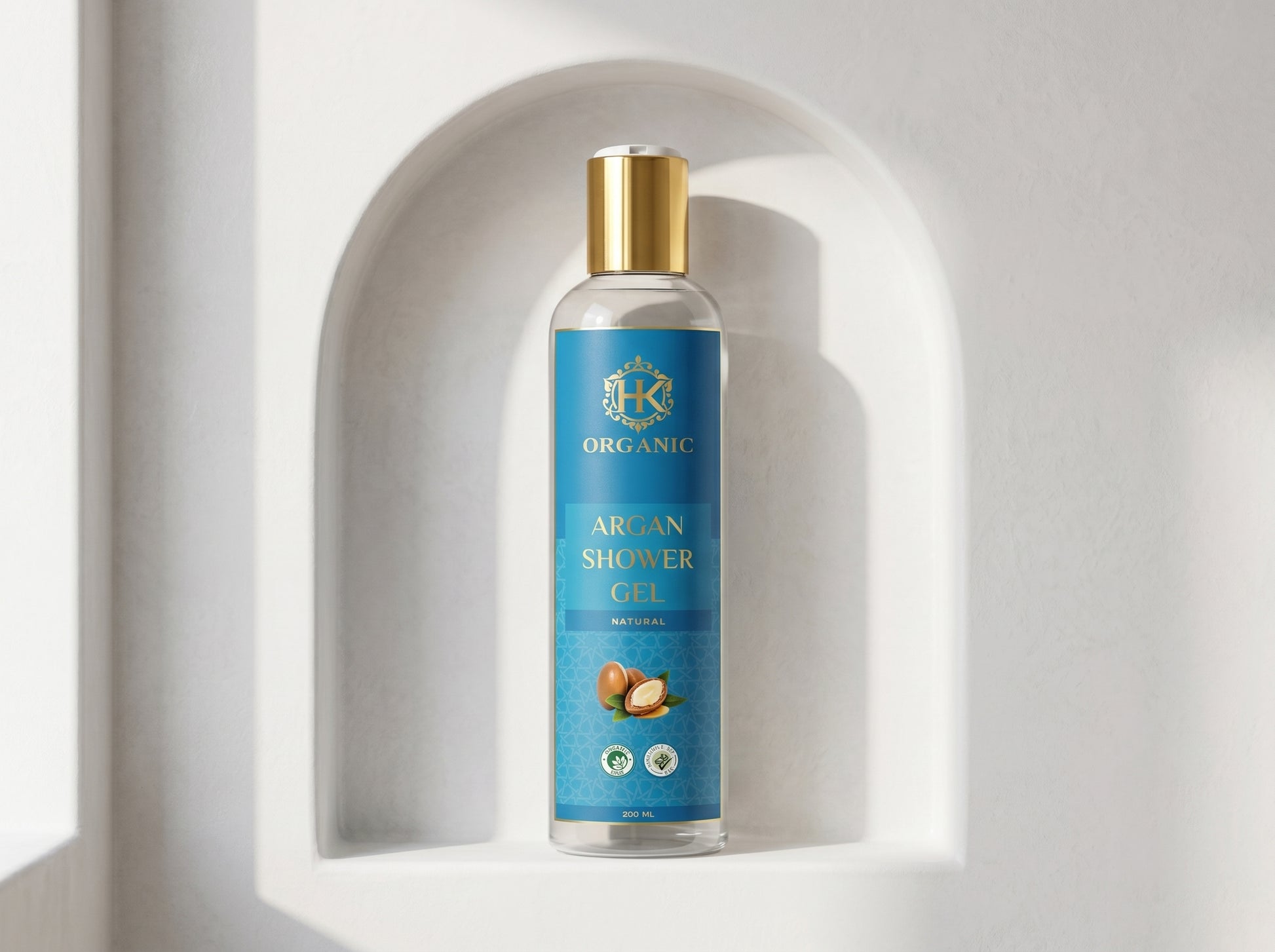 Bottle of organic argan shower gel on a white background