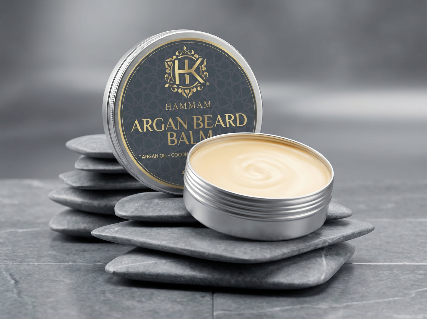 Hammam Argan Beard Balm container on a gray surface with a gray background