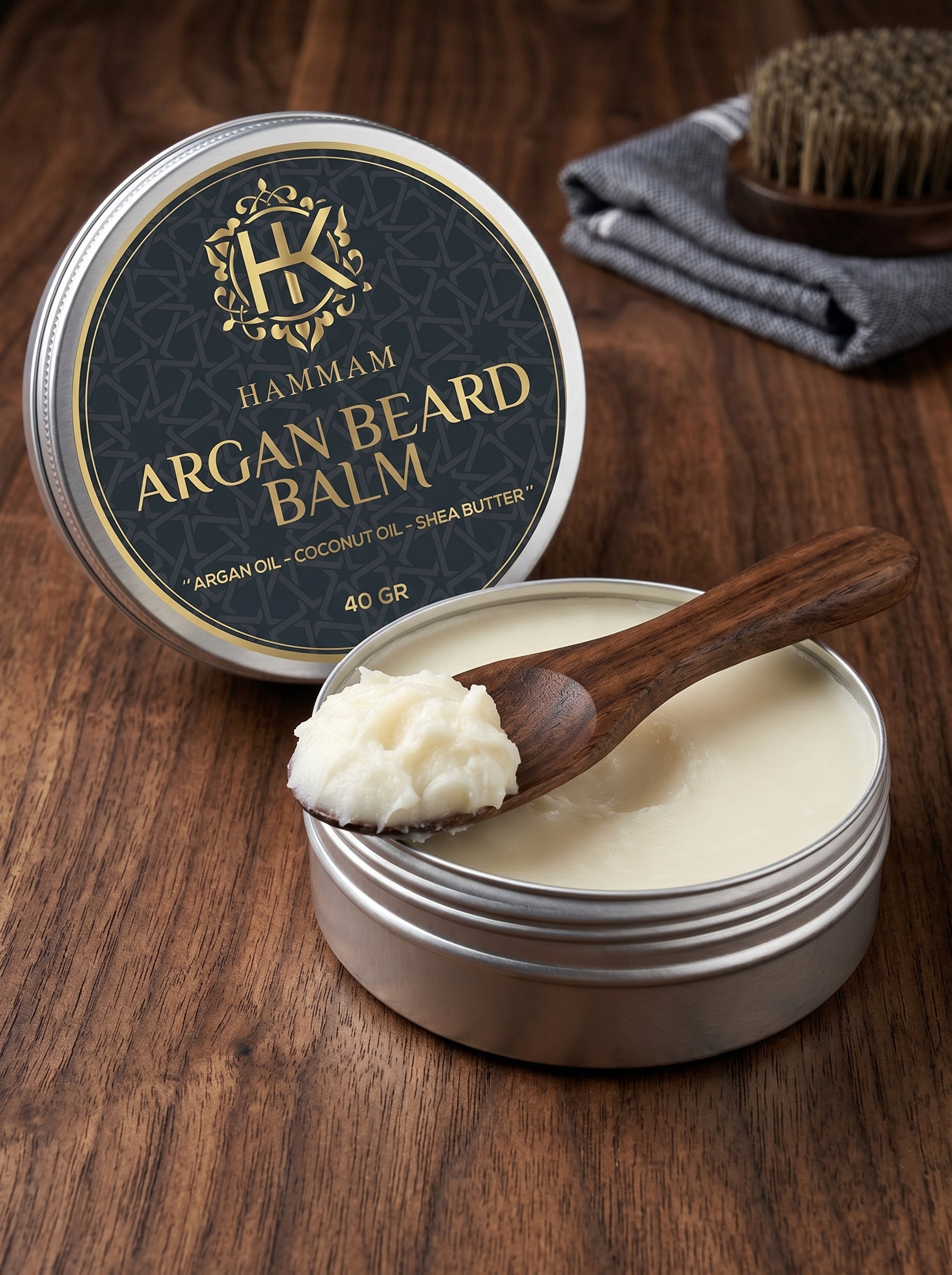 Hammm Argan Beard Balm container with a wooden spoon on a wooden surface