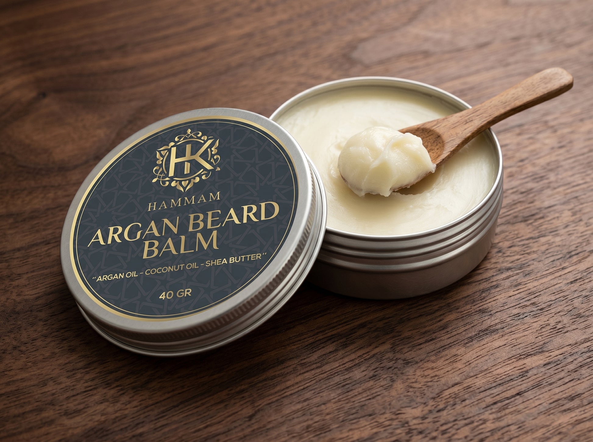 Hammam Argan Beard Balm with a wooden spoon on a wooden surface