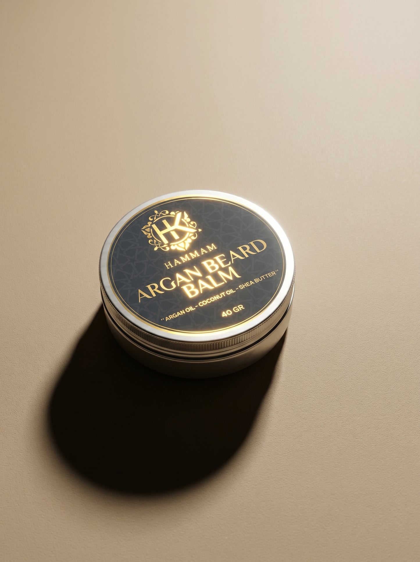Jar of argan beard balm with a gold lid on a beige background
