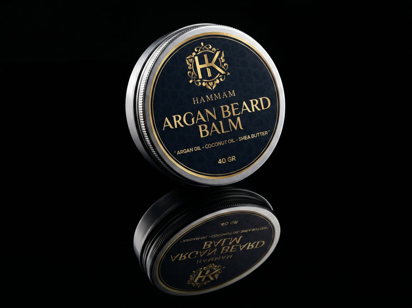 Hammam Argan Beard Balm container with reflective surface on a black background