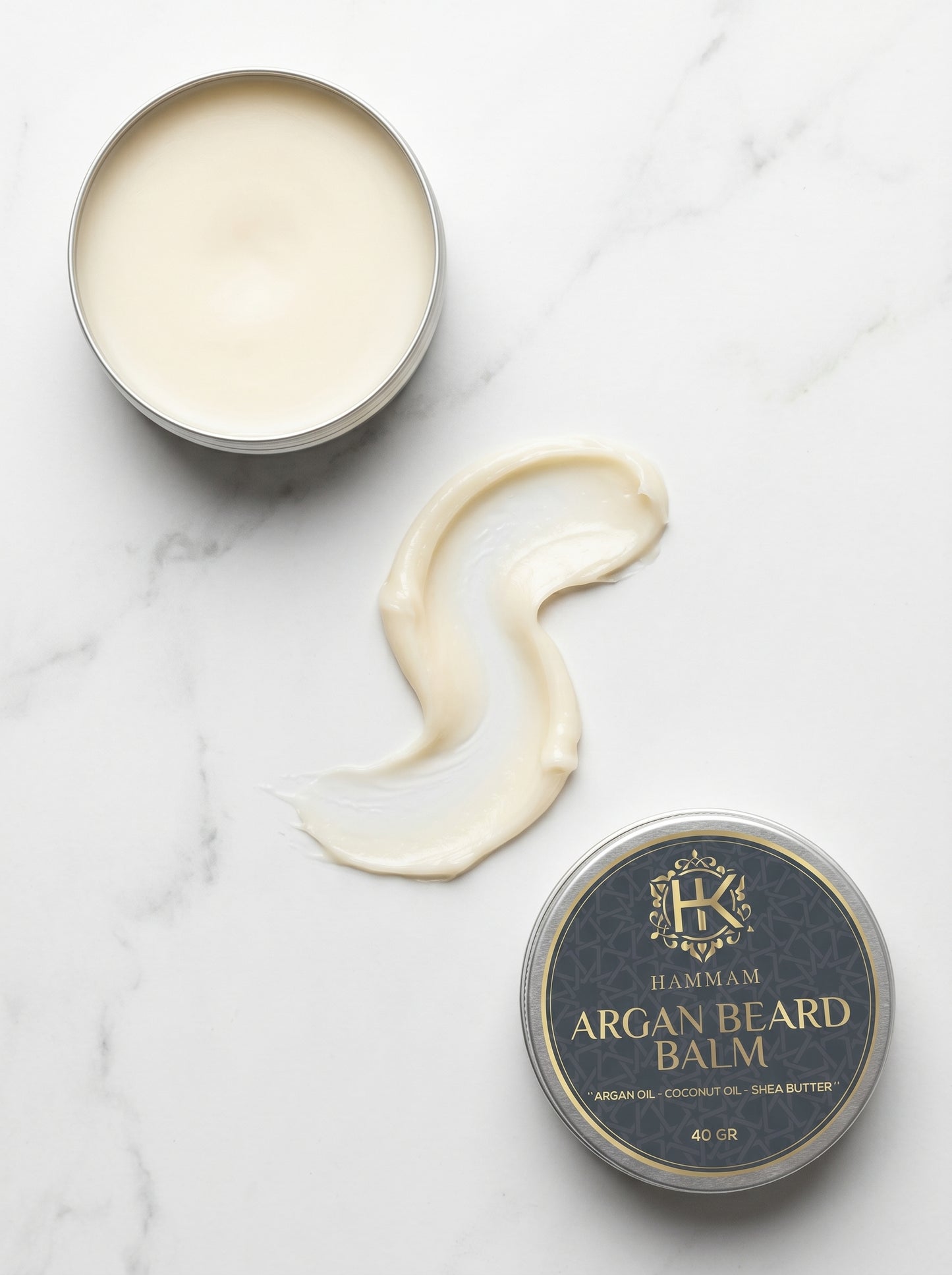 Argan beard balm with a visible brand logo on a marble surface