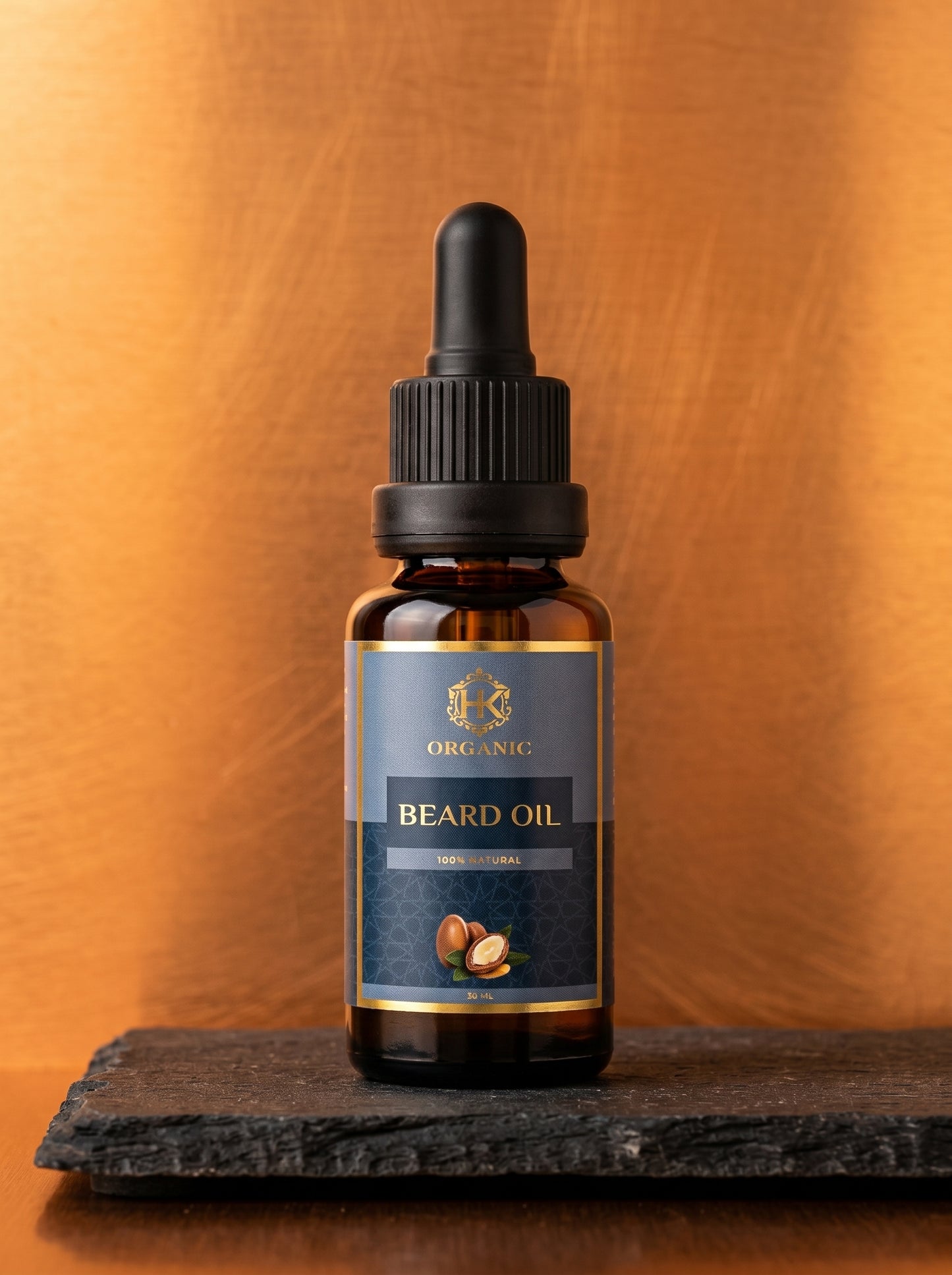 Bottle of organic beard oil with a dropper on a wooden surface