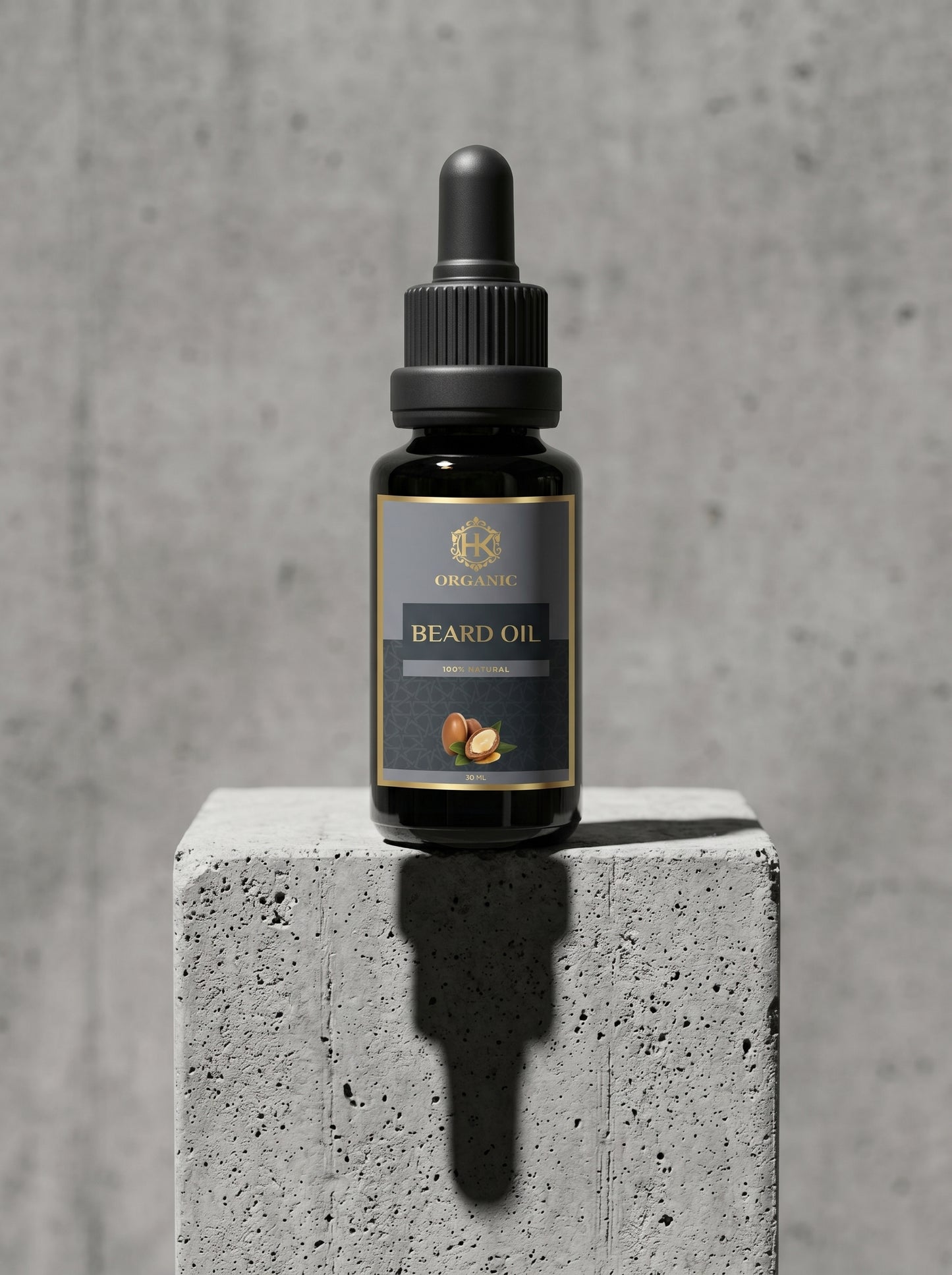 Bottle of beard oil on a concrete block with a gray background
