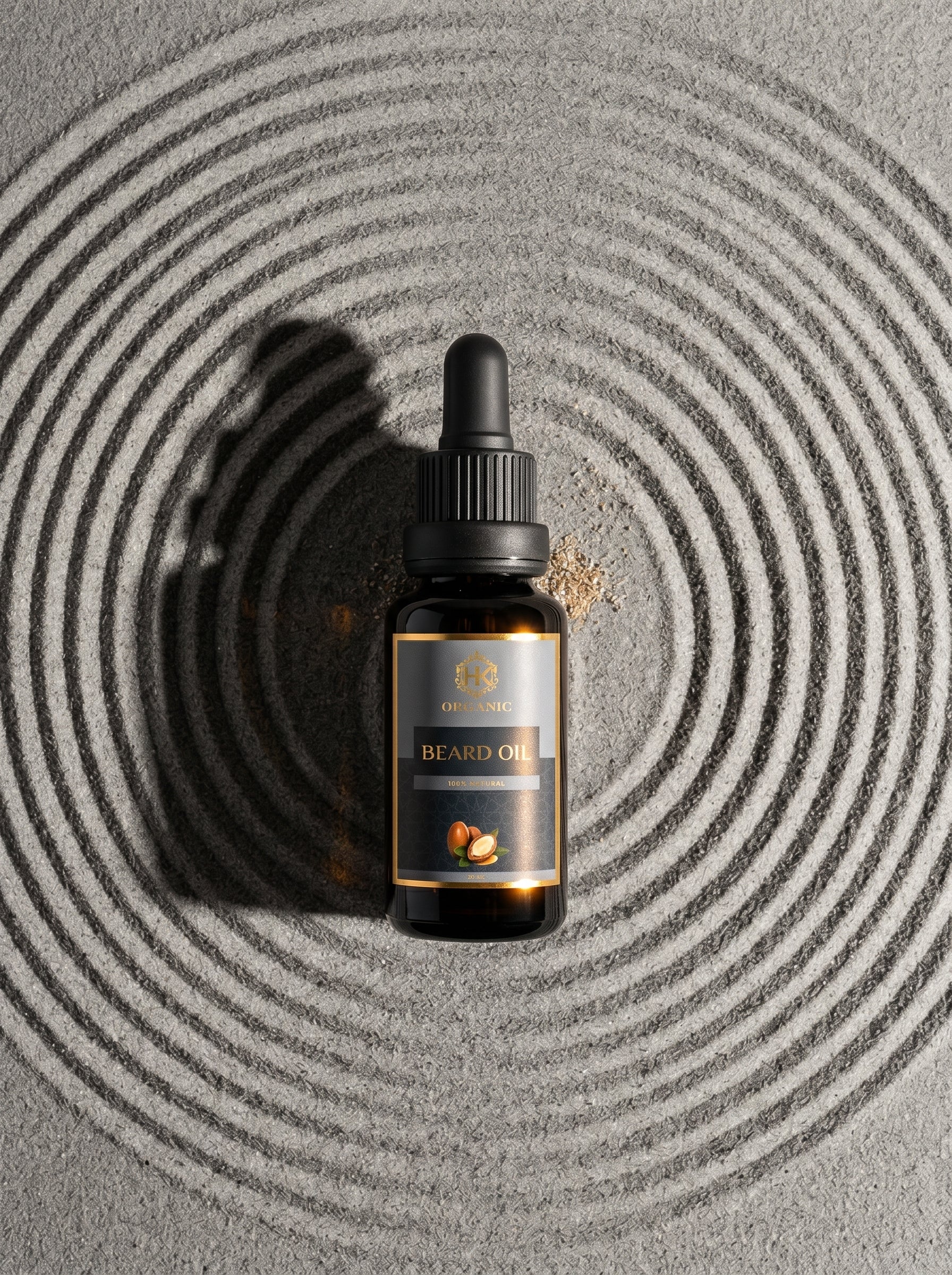 Beard oil dropper bottle on a textured gray surface