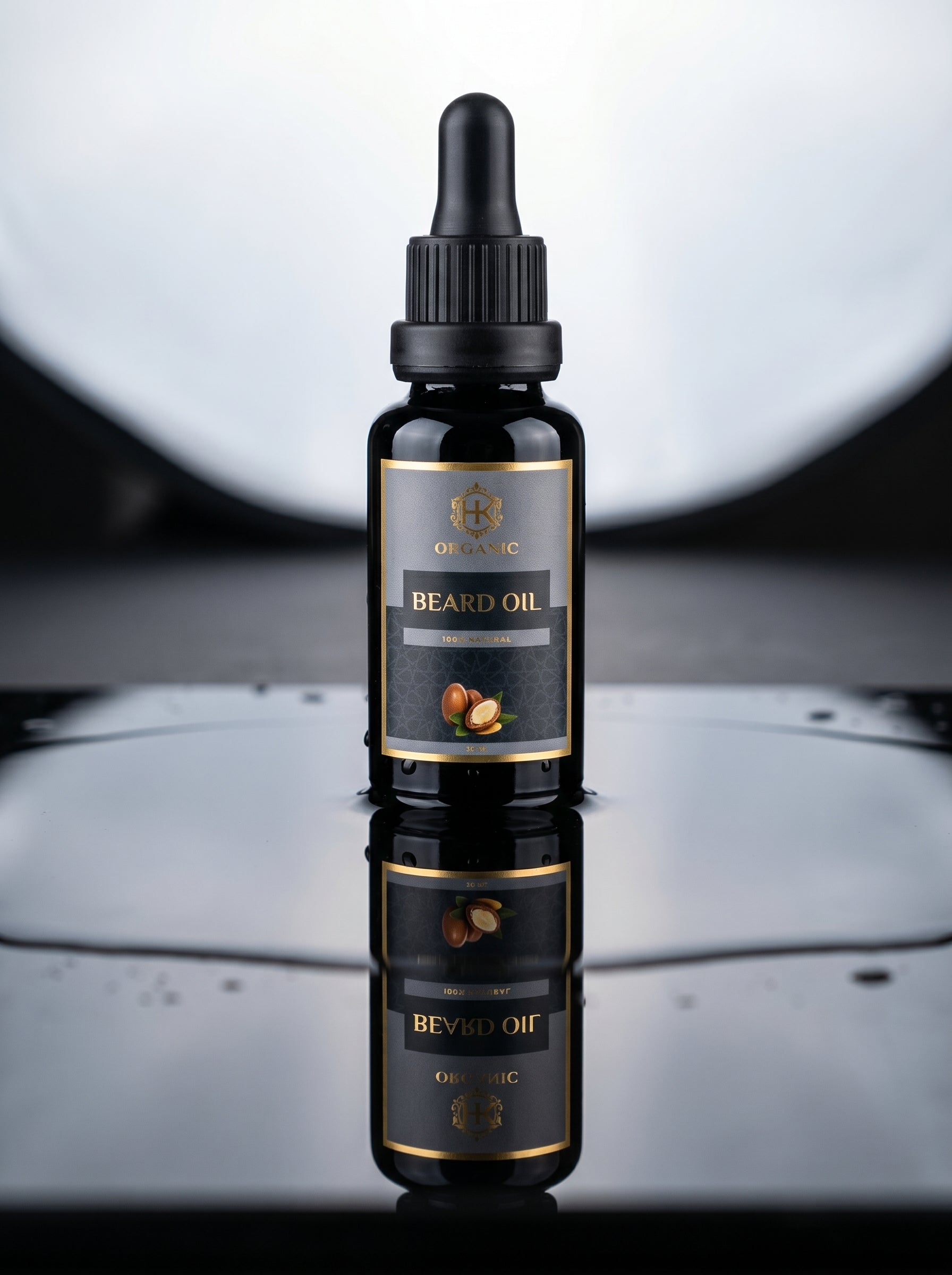 Black bottle of beard oil with dropper on a reflective surface
