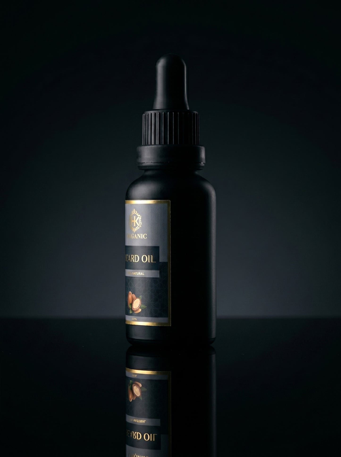 Black bottle with dropper on a reflective black surface and dark background