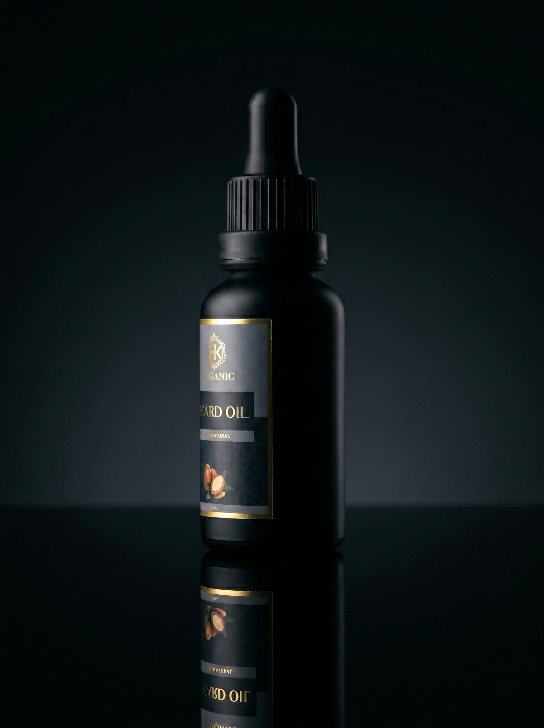 Black bottle with dropper on a reflective black surface and dark background