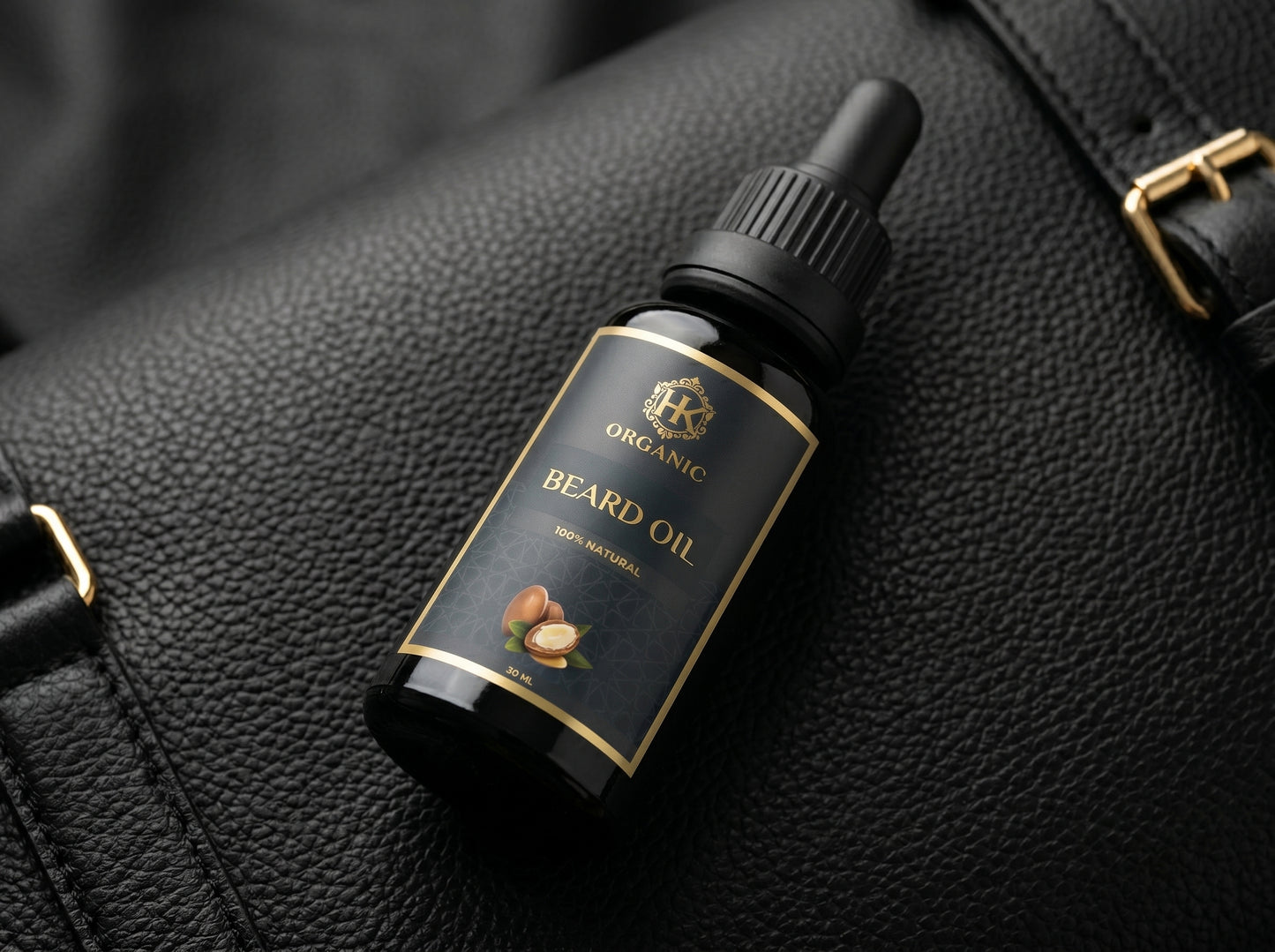 Bottle of organic beard oil on a black leather surface