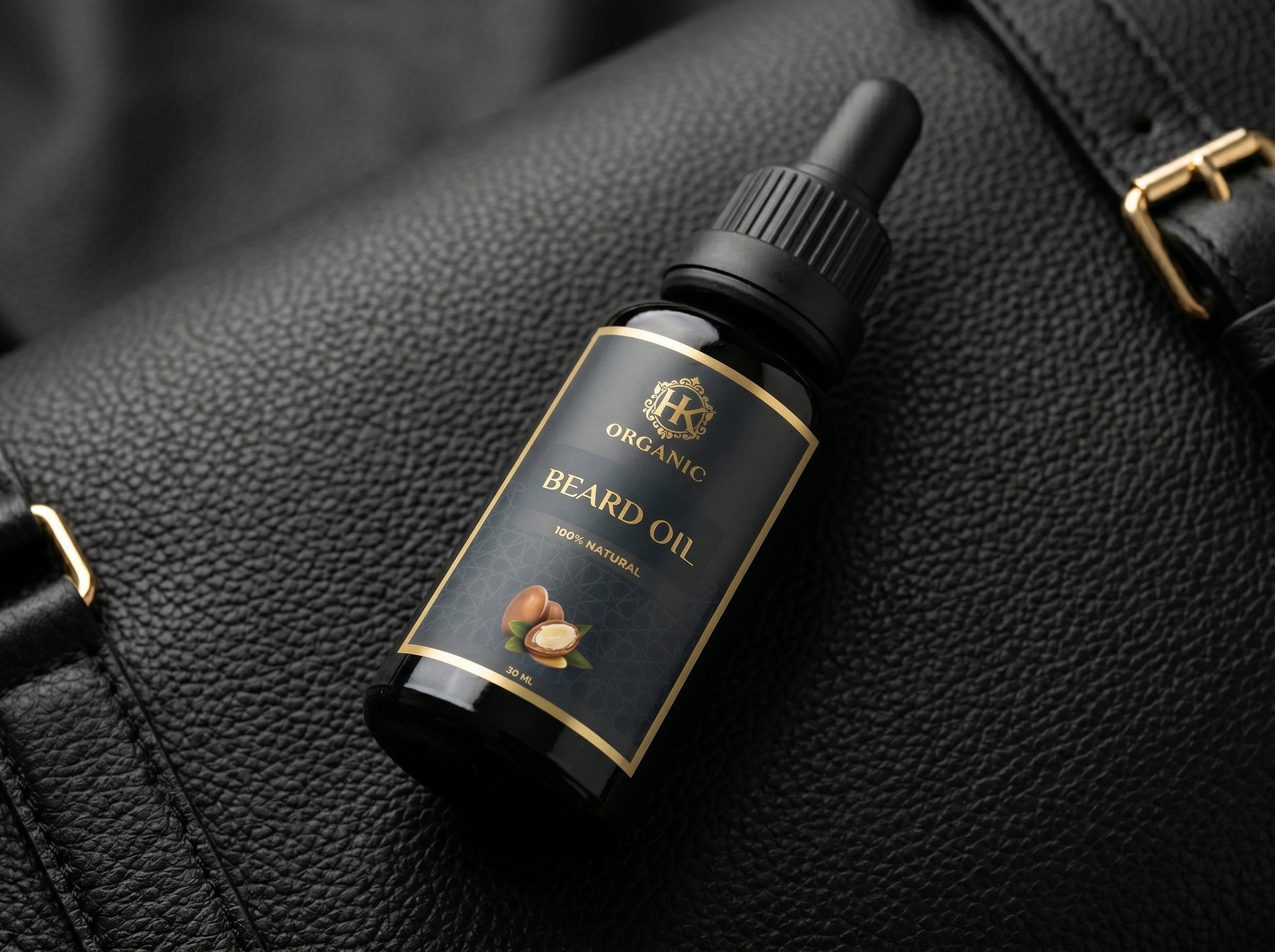 Bottle of organic beard oil on a black leather surface