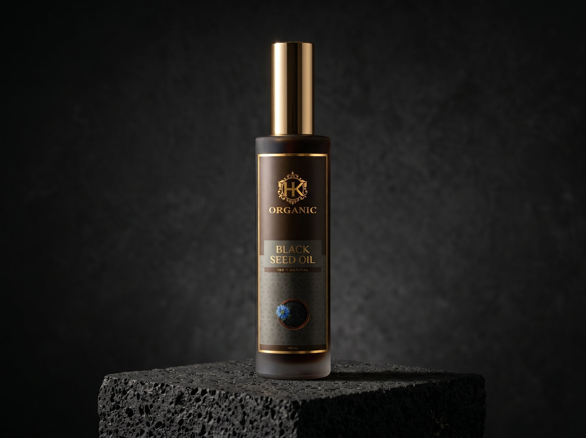 Bottle of organic black seed oil on a dark background