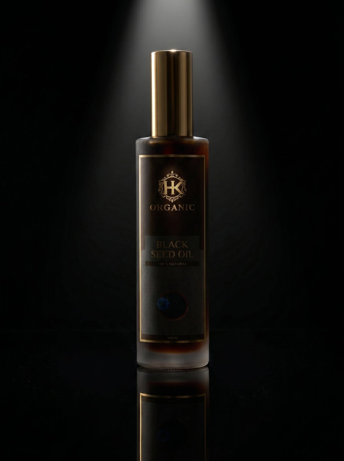 Bottle of HK Organic Black Seed Oil on a dark background