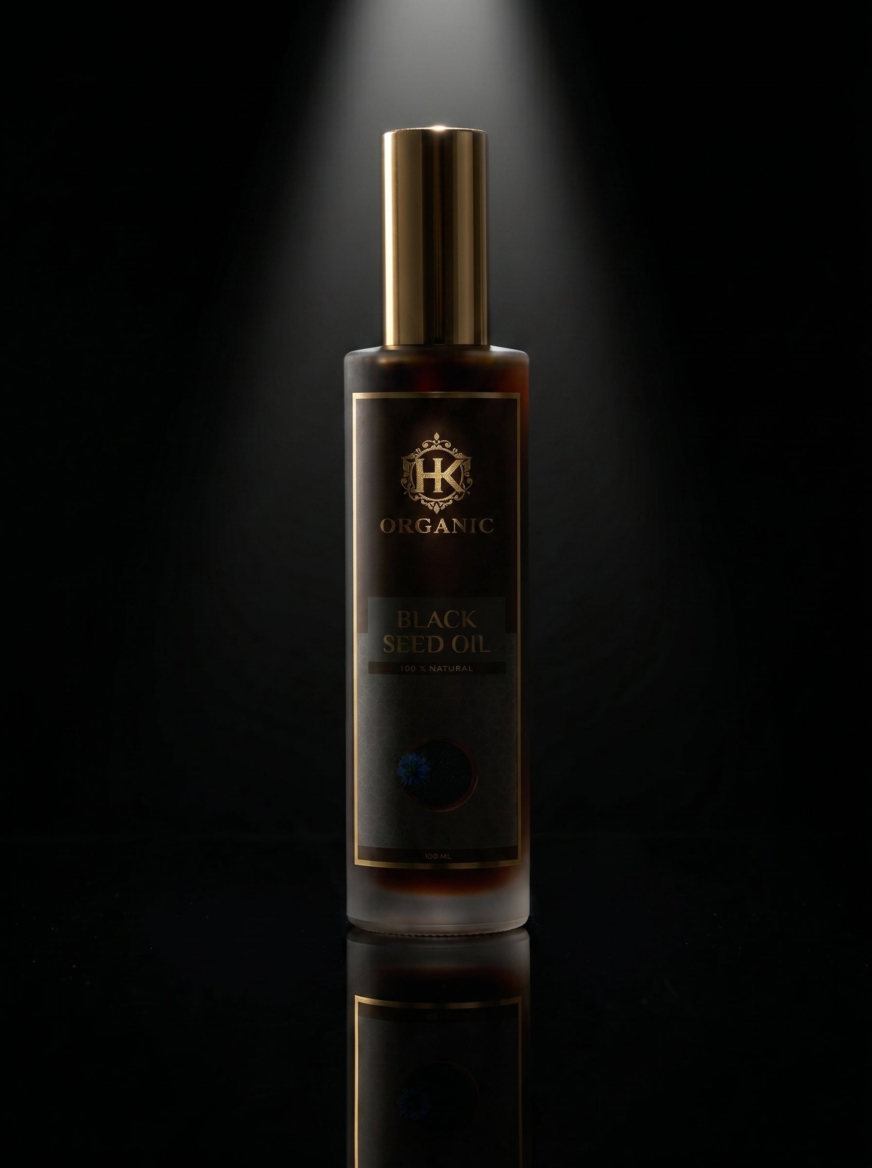 Bottle of HK Organic Black Seed Oil on a dark background
