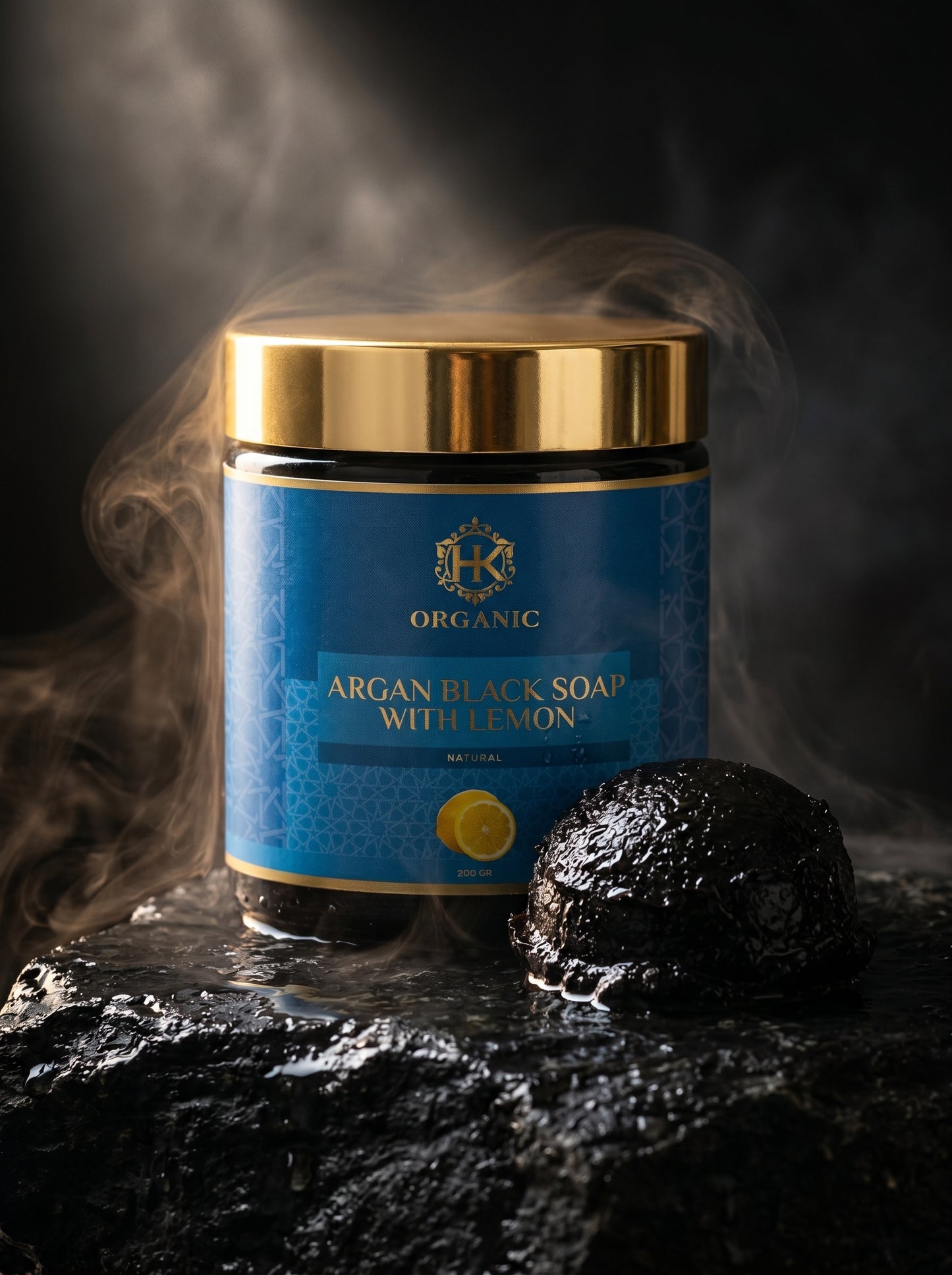 Blue jar of argan black soap with lemon on a dark background