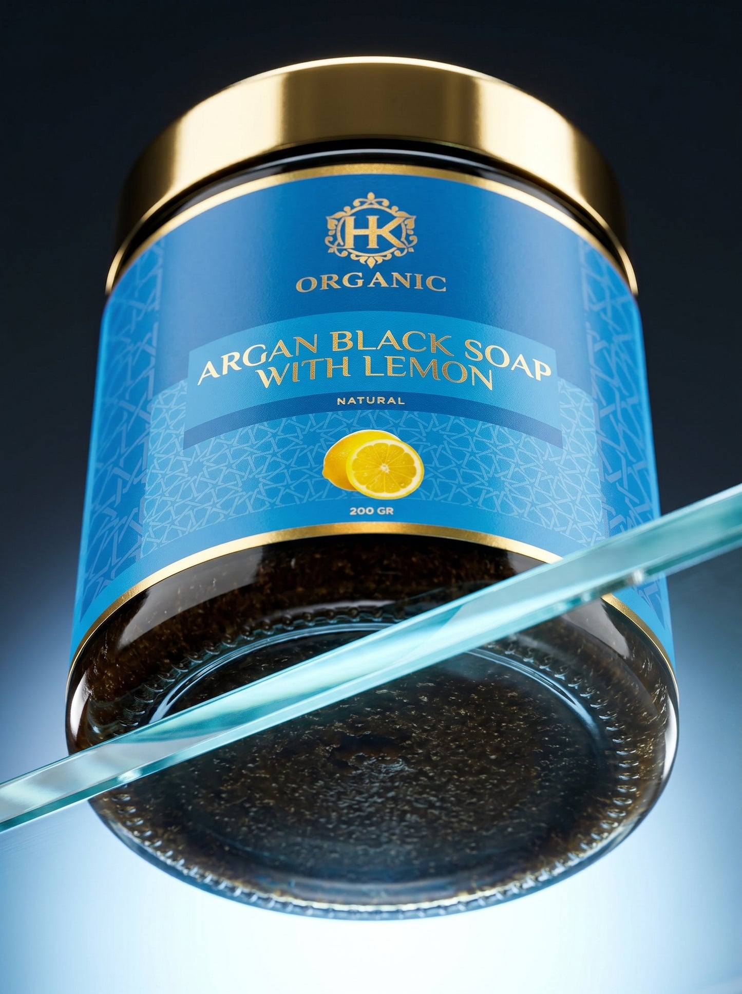 Jar of argan black soap with lemon on a gradient background