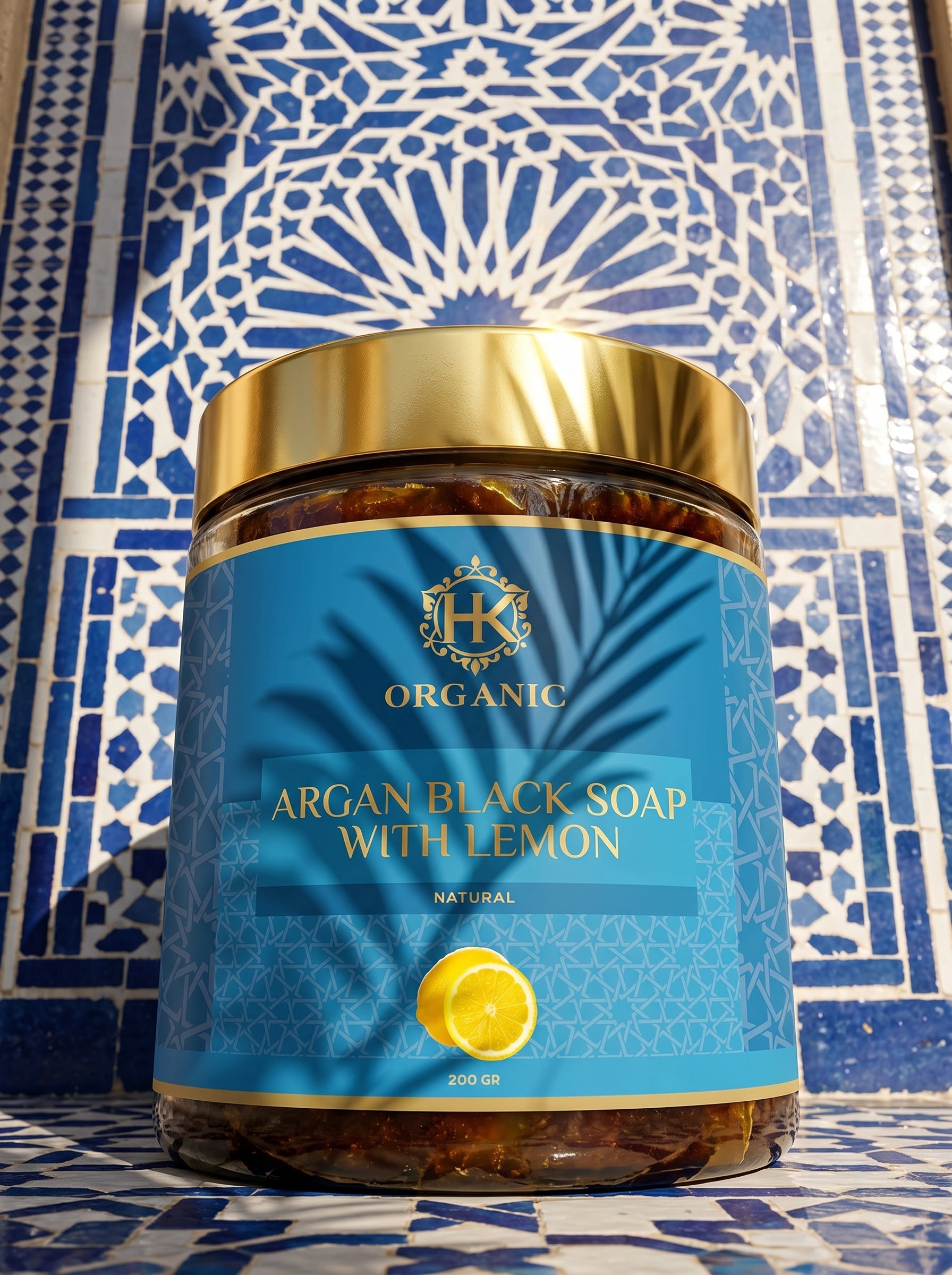 Jar of argan black soap with lemon on a blue patterned background
