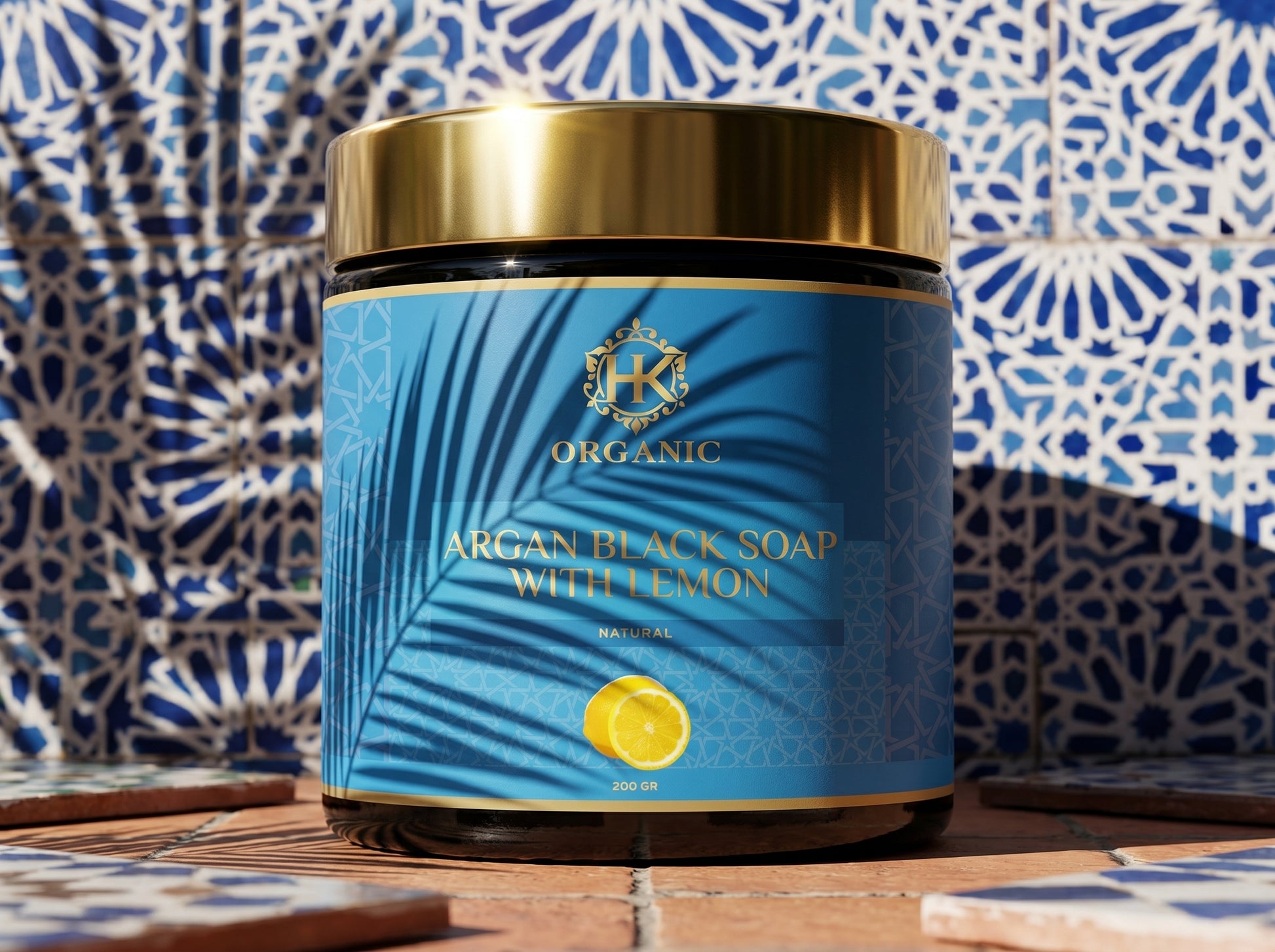 Jar of argan black soap with lemon on a decorative tile background