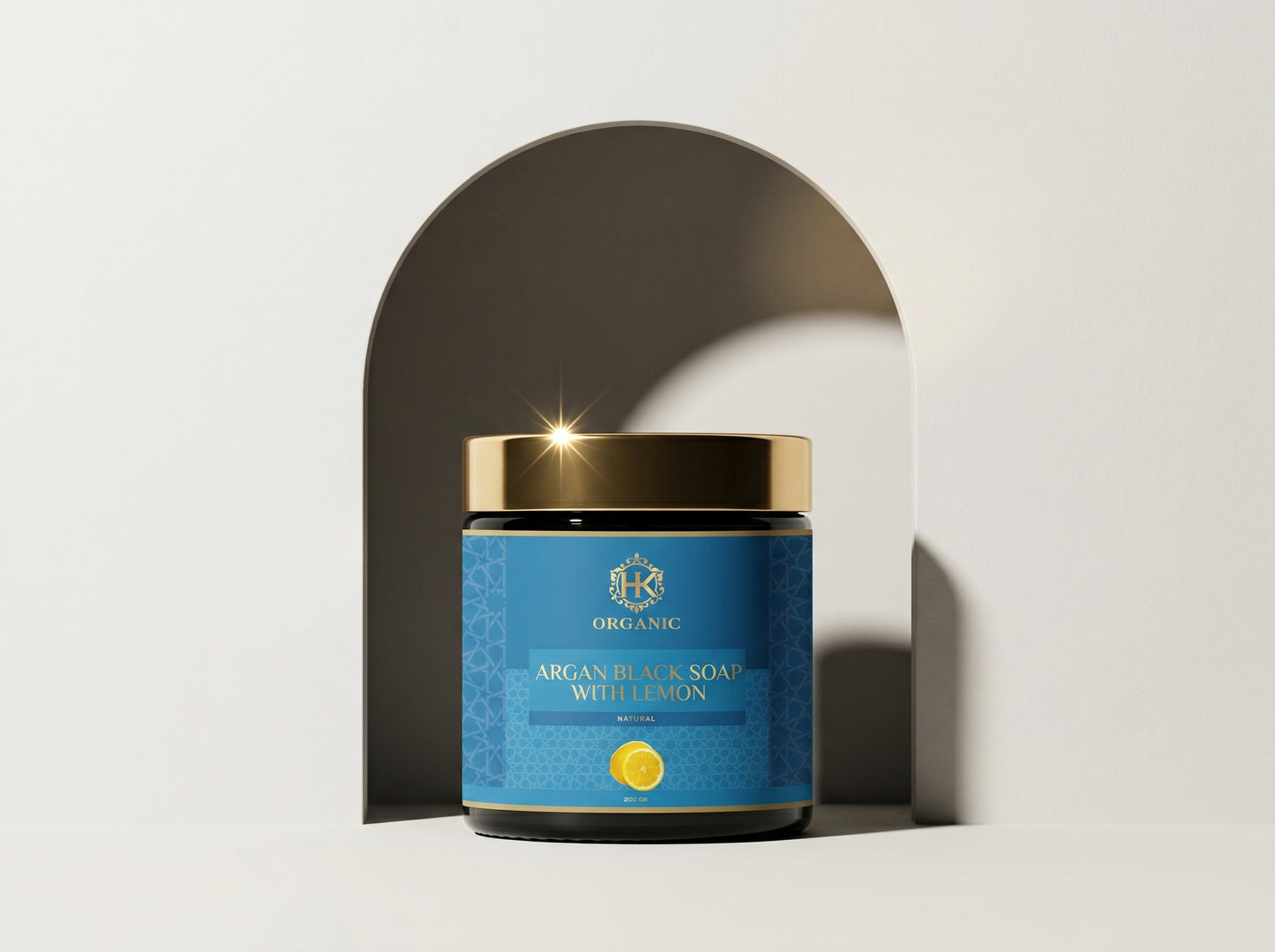 Blue jar with gold lid on a white background