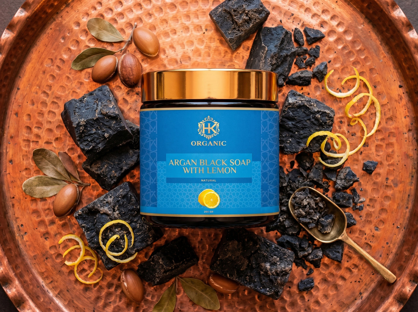 Argan black soap with lemon on a decorative copper tray