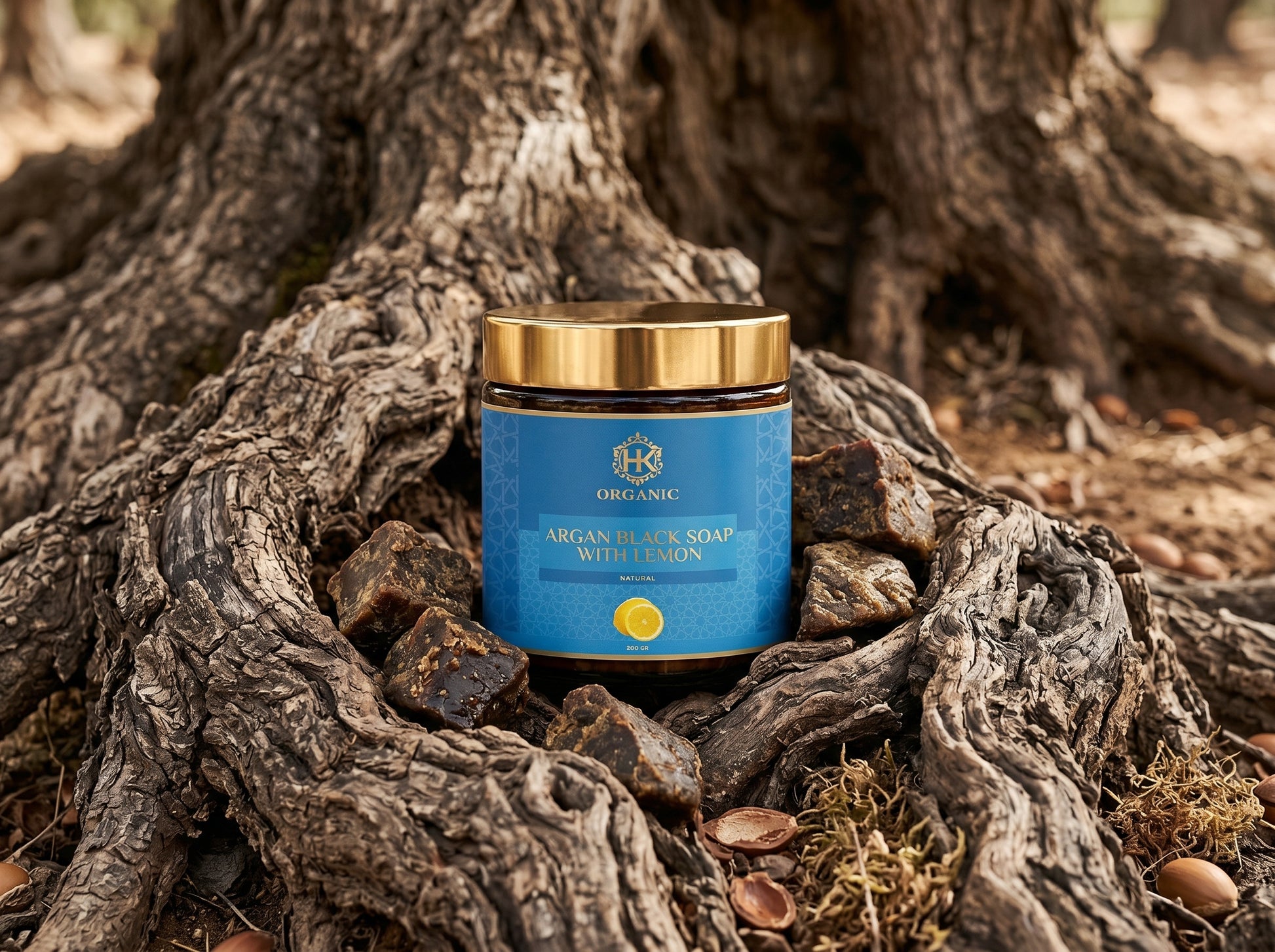 Jar of soap with a gold lid on a textured wooden surface