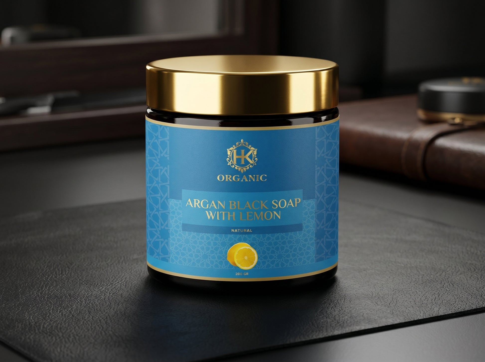 Jar of argan black soap with lemon on a dark surface