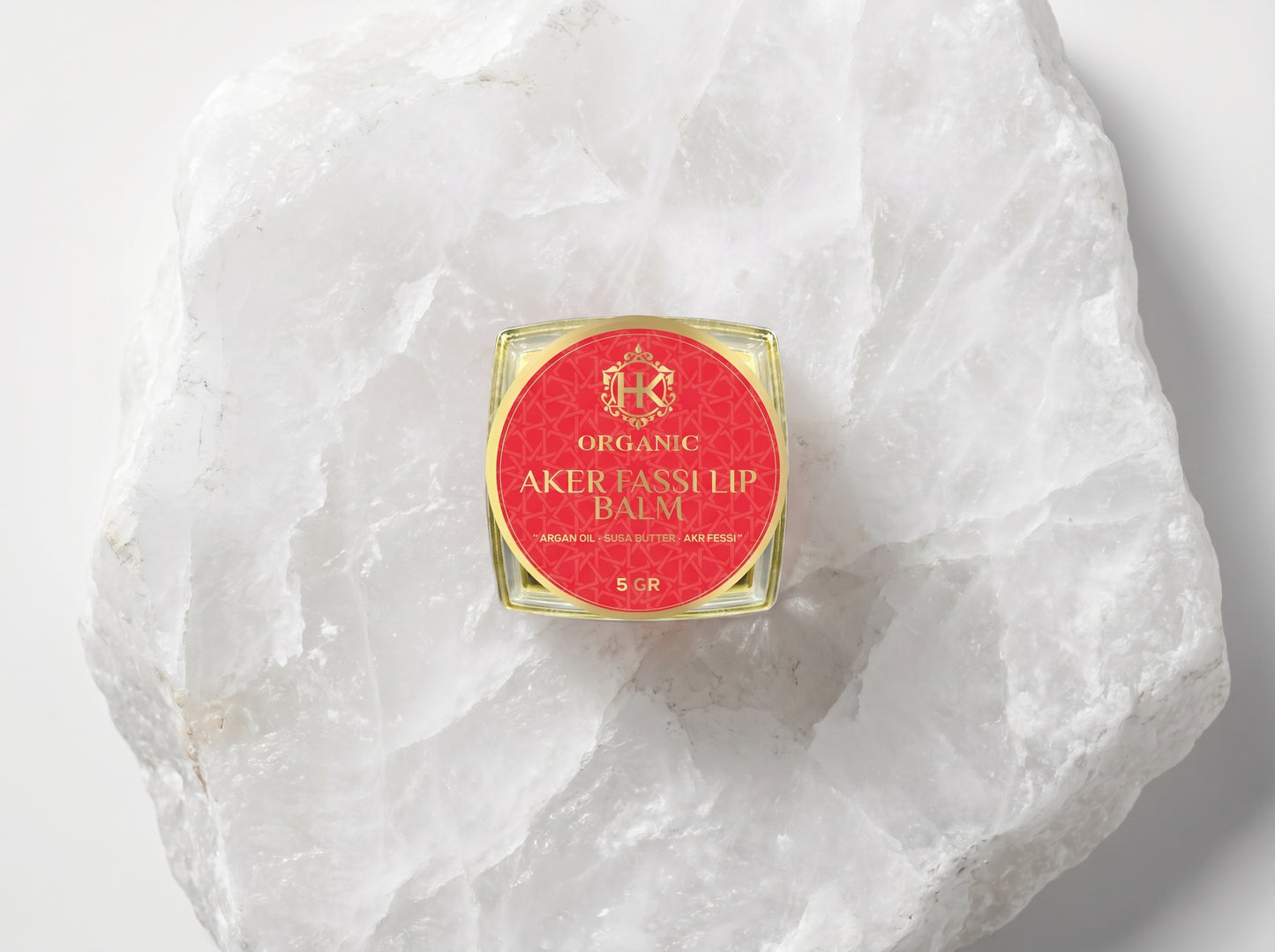 Lip balm container on a textured white surface