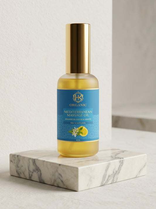 Bottle of Mediterranean Massage Oil on a marble surface with a light background