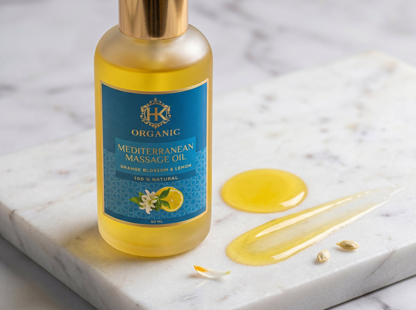 Bottle of Mediterranean Massage Oil with a blue label on a marble surface