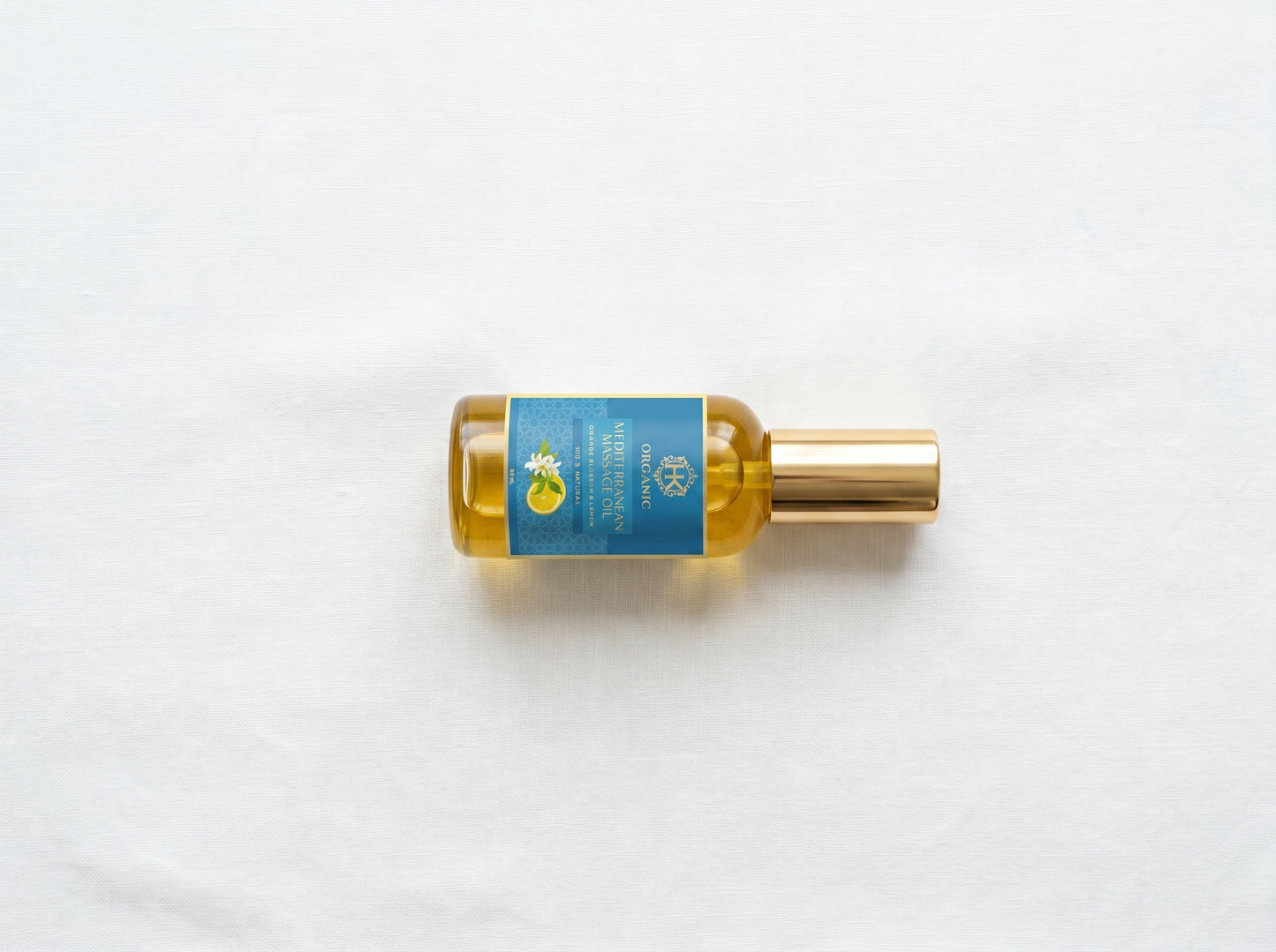 Bottle of oil with a blue label on a white background