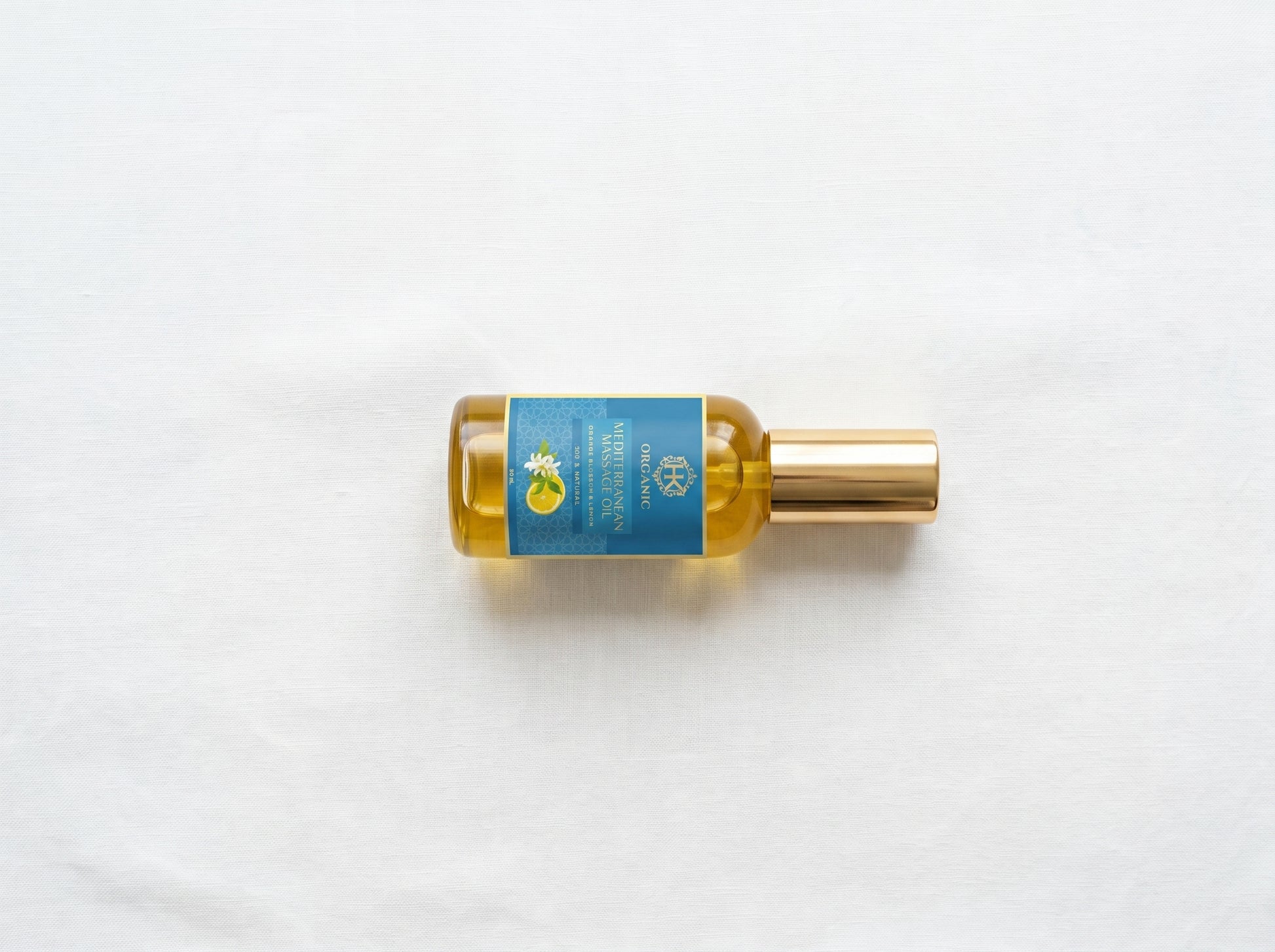 Bottle of oil with a blue label on a white background