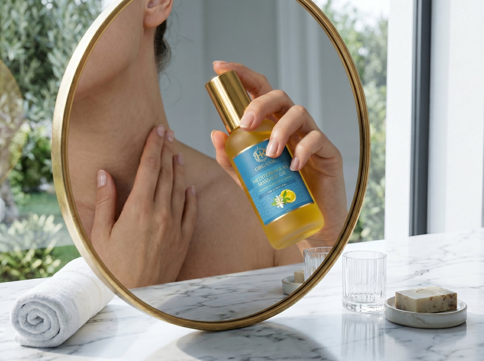 Person applying a bottle of oil to their shoulder in front of a mirror.