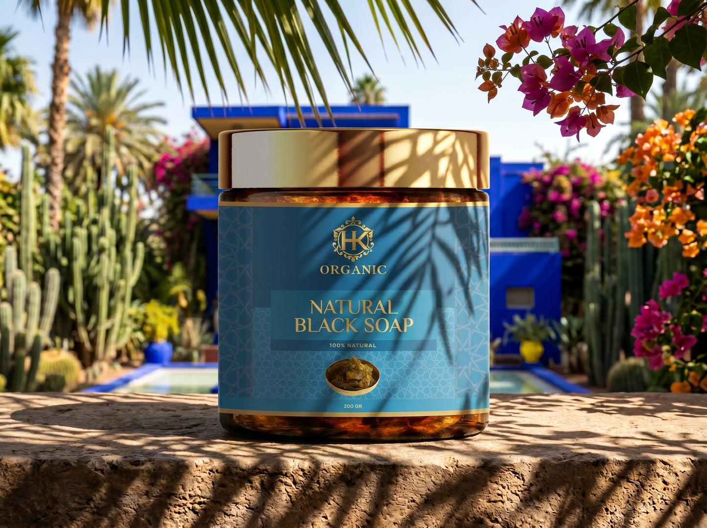 Jar of organic natural black soap with palm leaves and flowers in the background