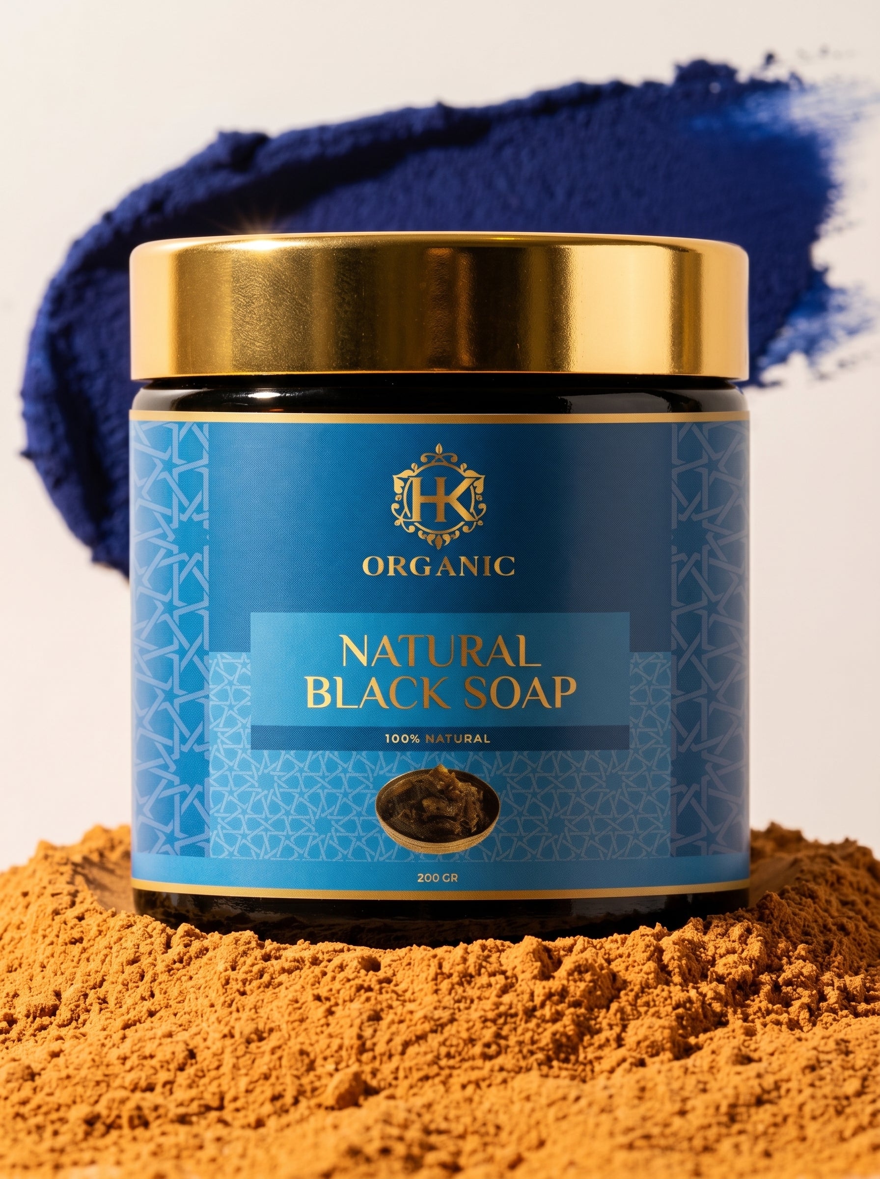 Jar of natural black soap with blue label on a white background