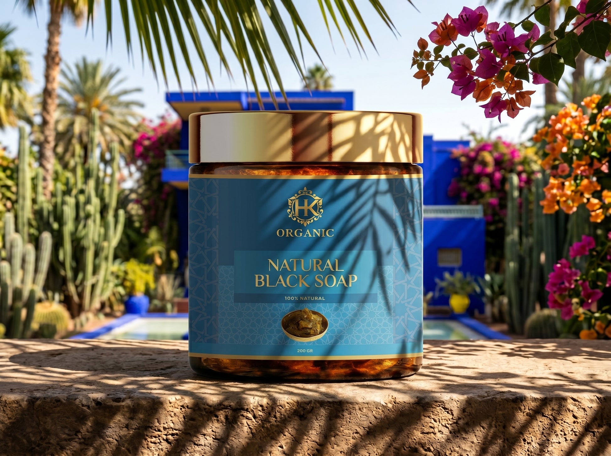 Jar of organic natural black soap with palm leaves and flowers in the background
