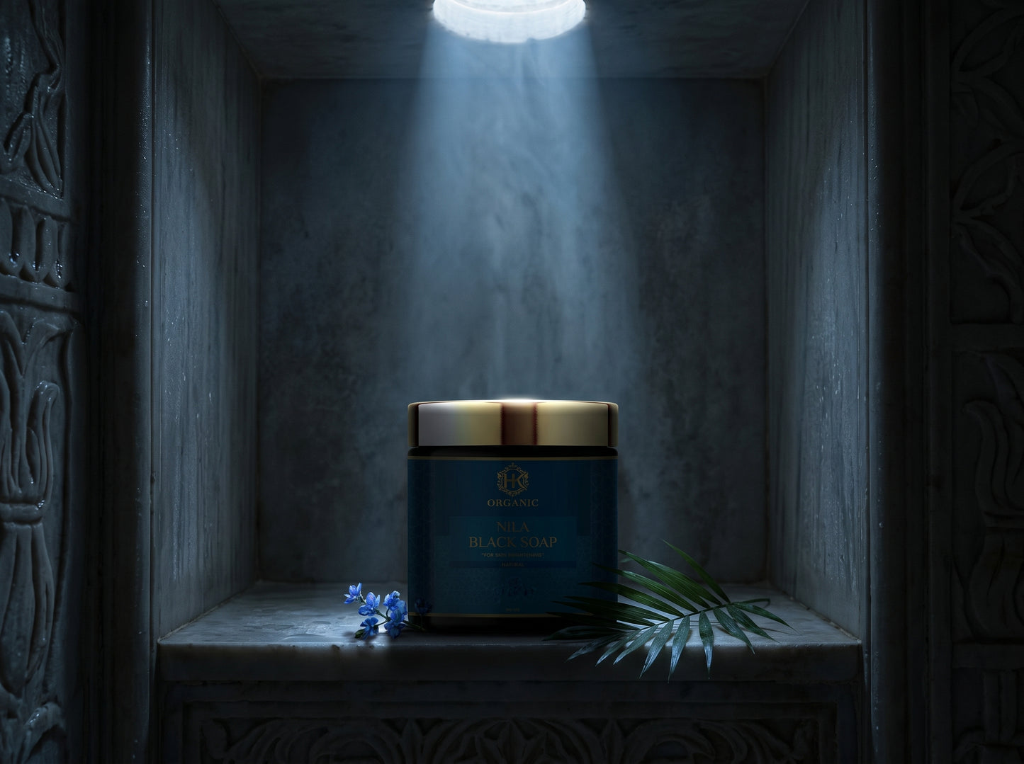 Candle in a decorative holder on a shelf with a spotlight effect